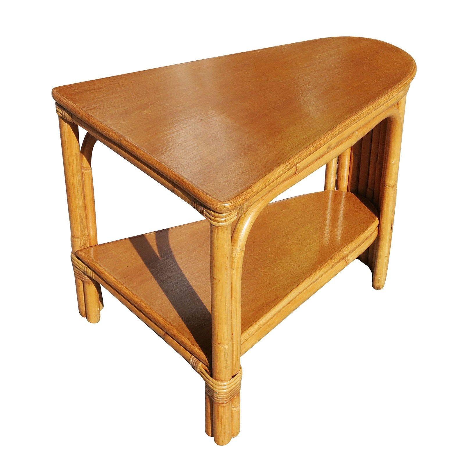Two-tier stick rattan corner side table with a Mahogany tabletop. A great example of early modern rattan design, circa 1940. 

1940, United States
Available-2 

We only purchase and sell only the best and finest rattan furniture made by the best and