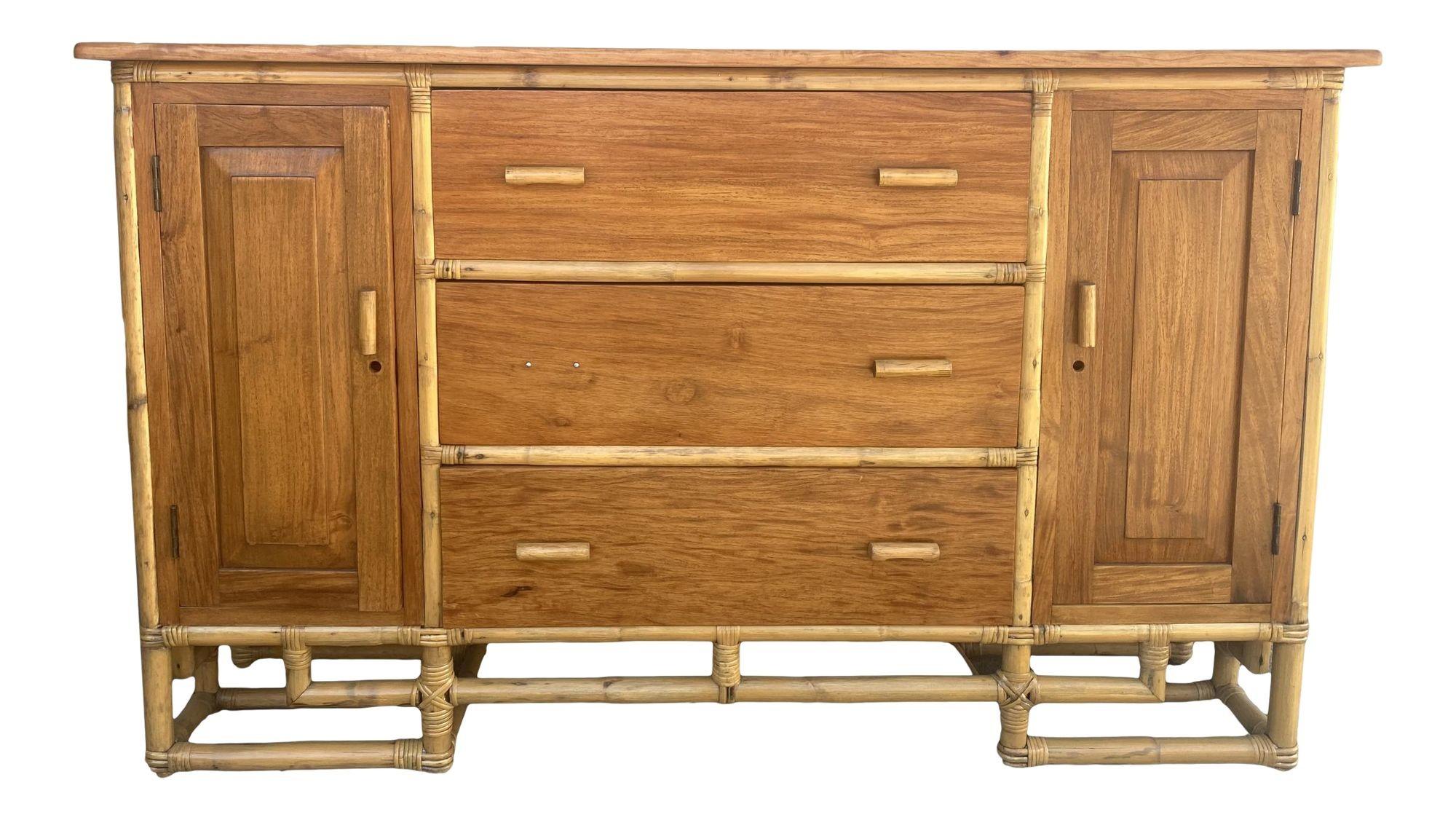 Paul Frank designed a Vertically stacked rattan sideboard with a mahogany top resting on an Asian-inspired base. It contains three pull-out drawers and two side cabinets with a fixed shelf in each.

1950, United States
The 1950s restored Paul Frankl