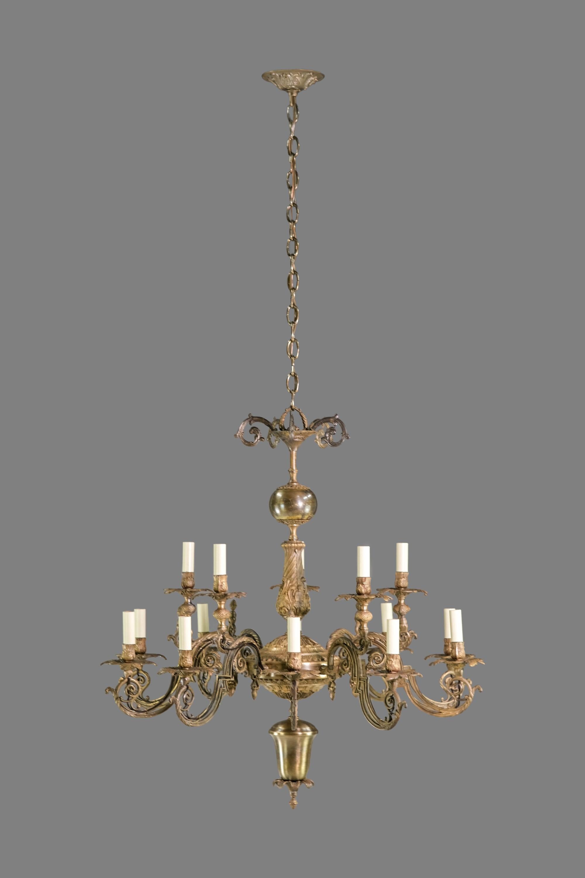 20th Century brass and brass finished Victorian chandelier with 10 arms arranged in 2 tiers. Floral design with small flower buds and leaves. Cleaned and restored. Takes 15 standard medium base light bulbs. Please note, this item is located in one