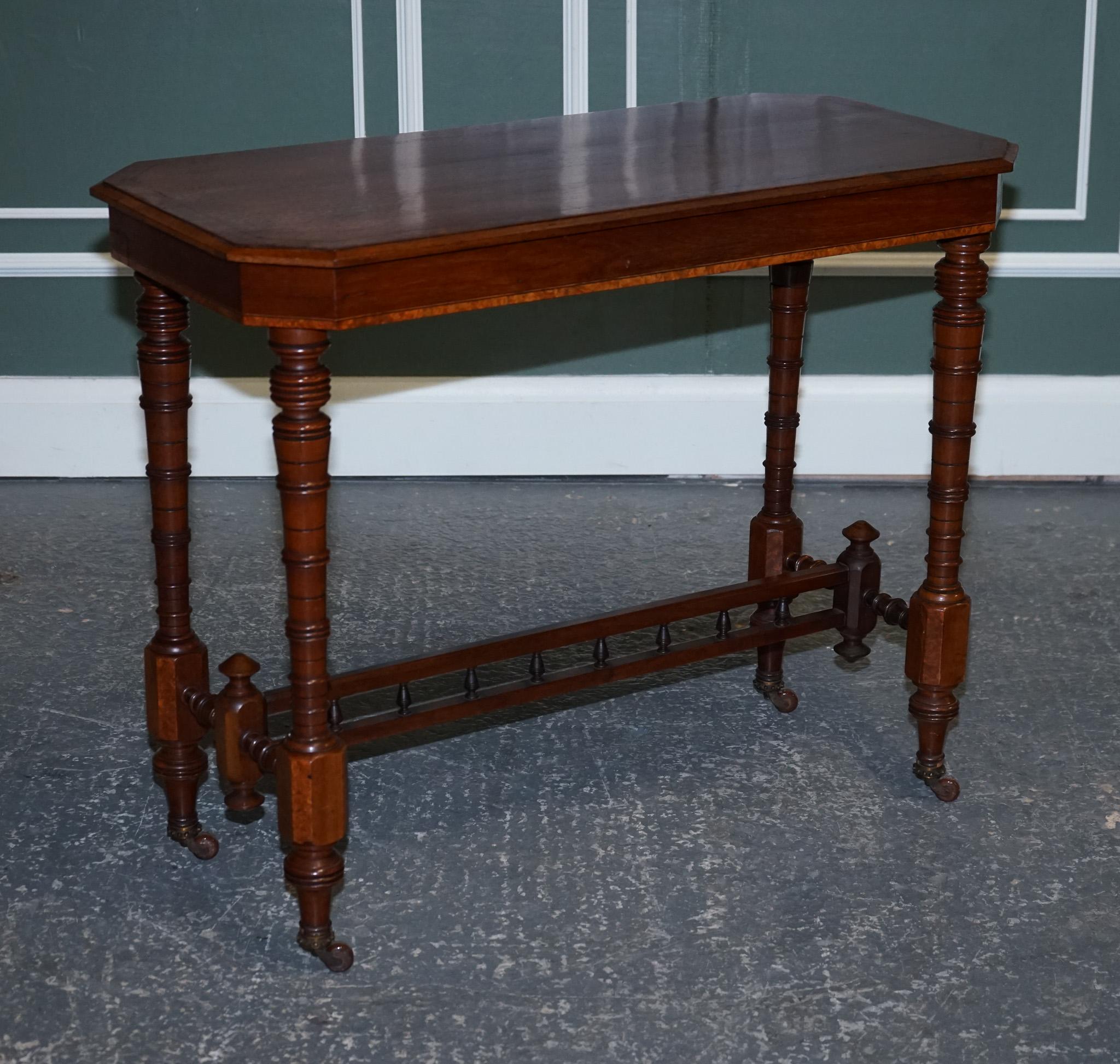 We are delighted to offer for sale this Restored Walnut Console Table with Burr Walnut Wood.

A walnut console table with inlaid burr walnut wood and a whatnot design is a beautiful piece furniture that combines with elegance and functionality.