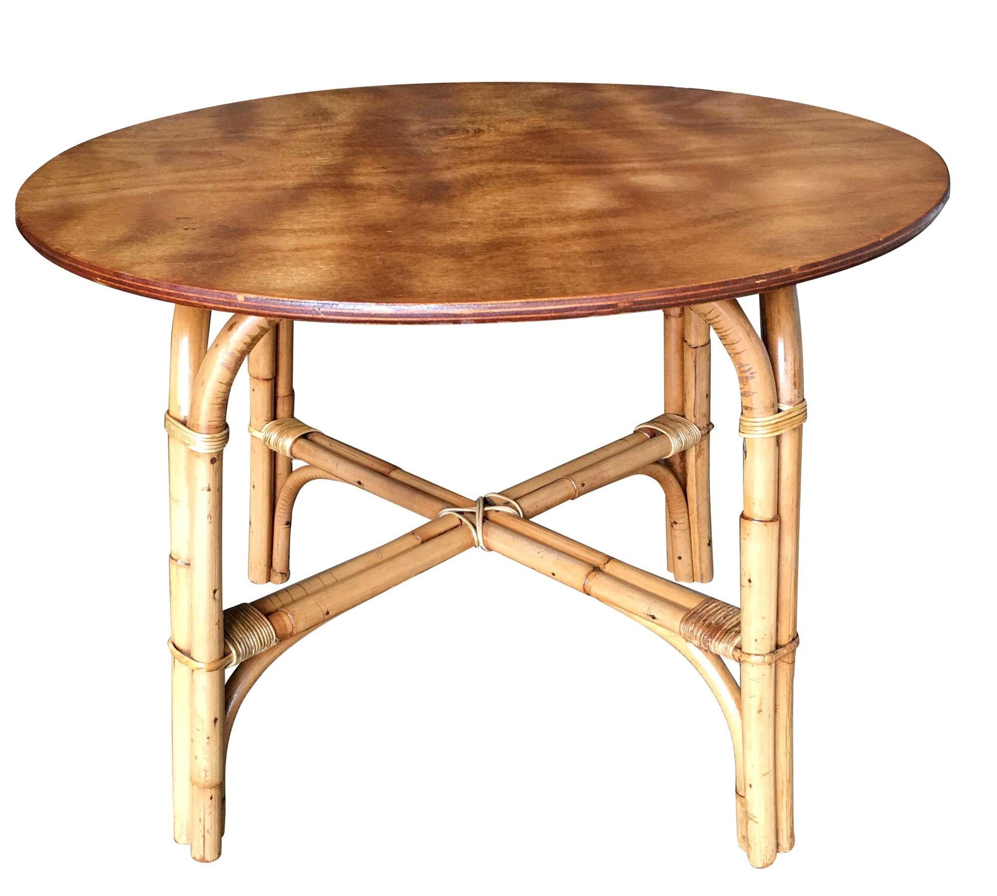 This beautifully restored Paul Frankl-inspired rattan blends vintage charm with modern comfort.  It is a round rattan coffee table with an oak top and a two-strand 