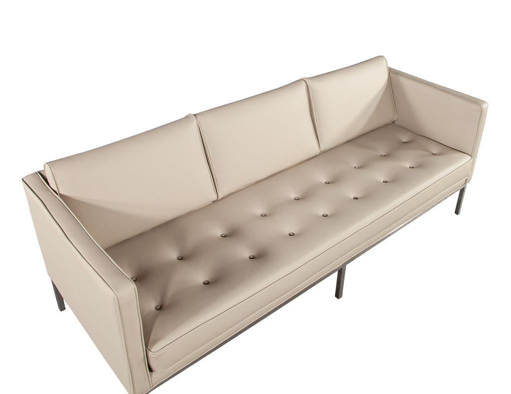 Restored Vintage Mid-Century Modern Tufted Sofa in Cream Faux Leather 7
