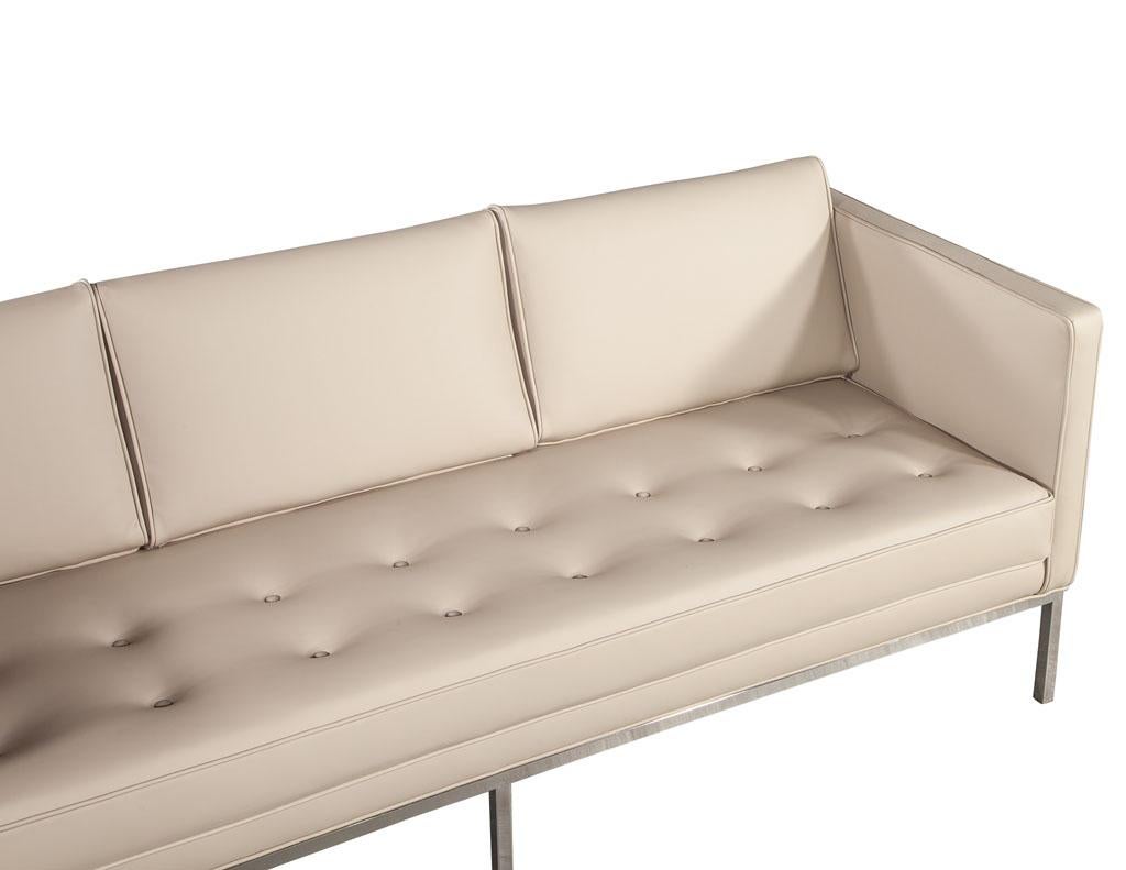 Restored Vintage Mid-Century Modern Tufted Sofa in Cream Faux Leather 10