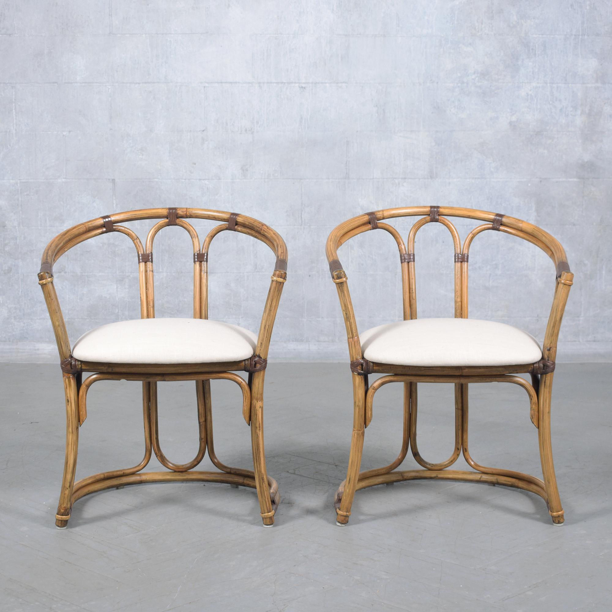 Discover the charm of our pair of vintage bamboo barrel chairs, exquisitely crafted and fully restored by our in-house professionals. The pair of chairs feature a natural bamboo color accented with brown details and a protective satin lacquer