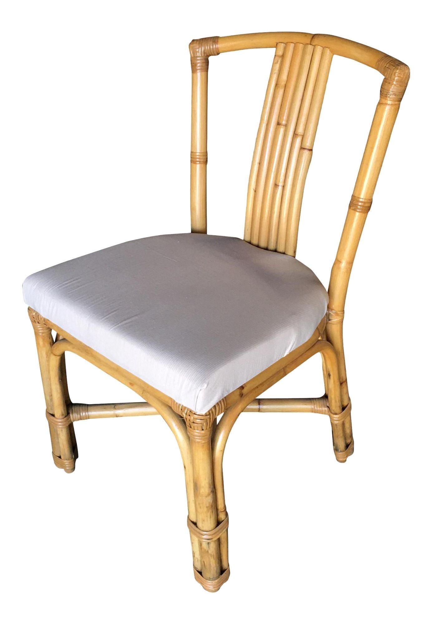 Vintage rattan side chair, chair features a 6-strand seat back and white cotton fabric foam padded seat. Restored to new for you. 

1950, United States

We only purchase and sell only the best and finest rattan furniture made by the best and