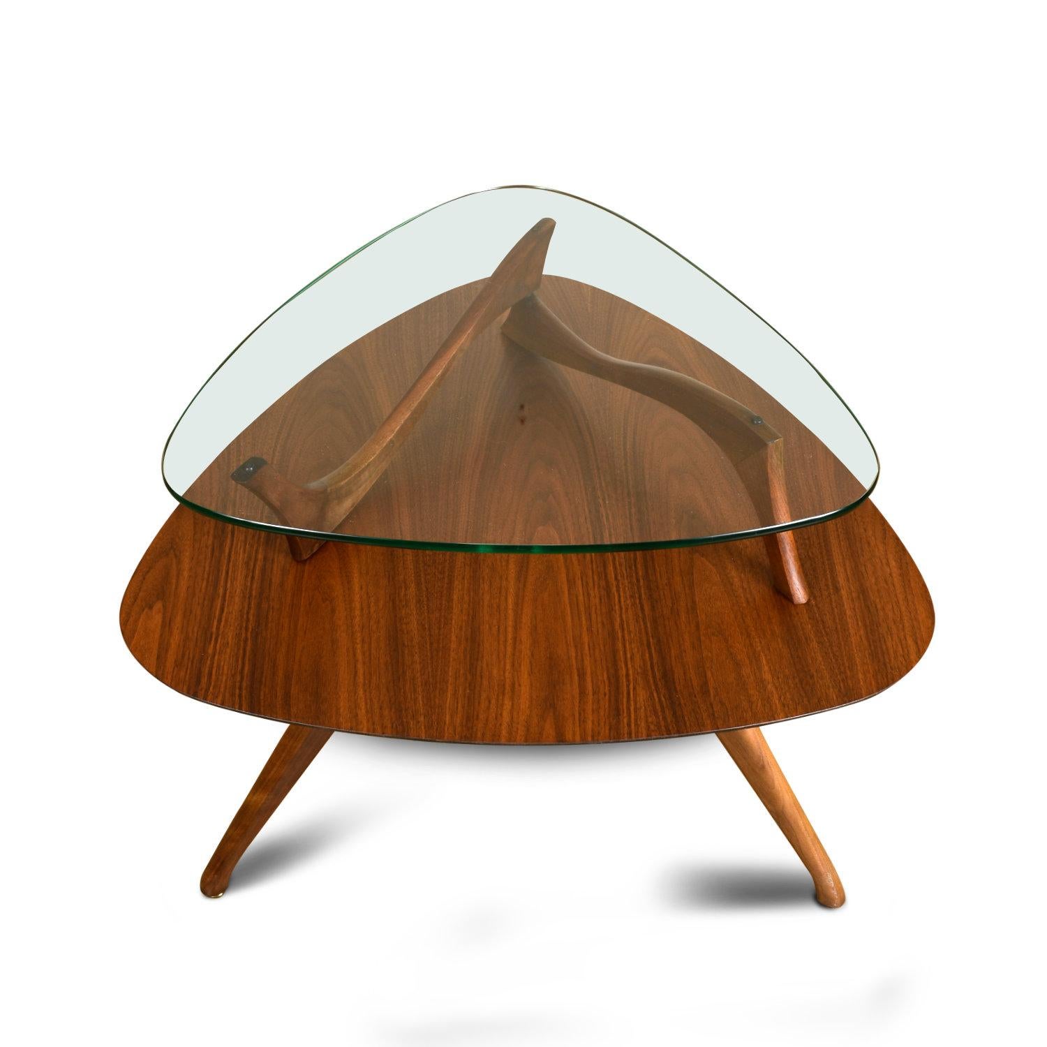 Outstanding triangular Mid-Century Modern side table. This guitar-pick shaped end table is exhibits absolutely exquisite styling and quality. Our restoration team fully disassembled this piece to refinish the walnut wood, breathing new life into
