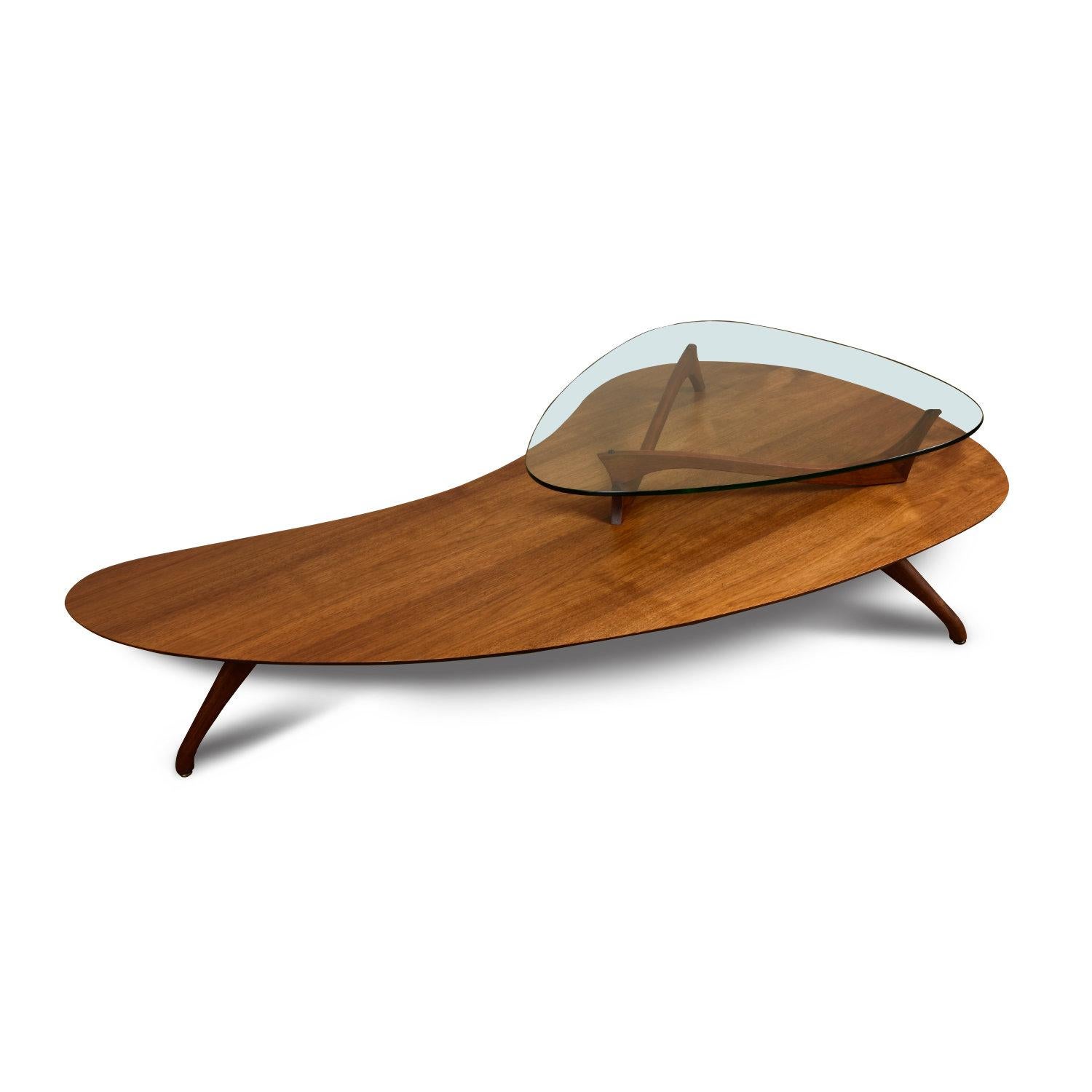 Outstanding amorphic two-tier Mid-Century Modern boomerang coffee table. This fabulous table is exhibits absolutely exquisite styling and quality. Our restoration team fully disassembled this piece to refinish the walnut wood, breathing new life