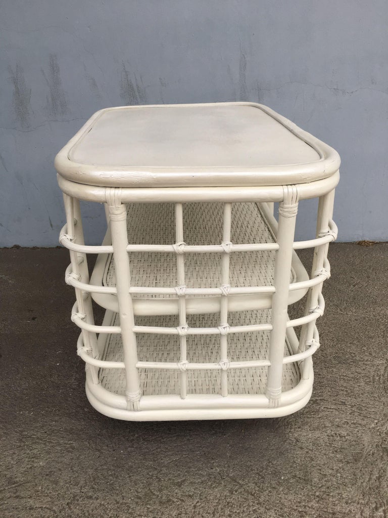 Restored White Painted Midcentury Rattan Side Table Bookshelf For Sale