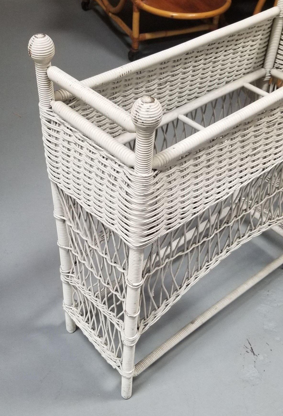 Elevate your botanical beauties with our Restored White Rattan Wicker Plant Stand, a shabby chic boho treasure. Lovingly restored, this piece exudes charm and character. Its intricate rattan design and distressed white finish make it the perfect
