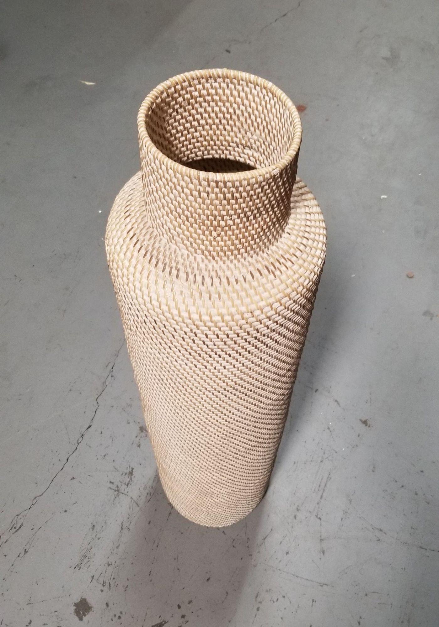 Single Gabriella Crespi-styled decorative floor vases made from stacked white-beige reed pencil rattan rings with wicker weave. Perfect for holding dried plant arrangements or simply standing on its own.

Circa 1970, United States

We only purchase