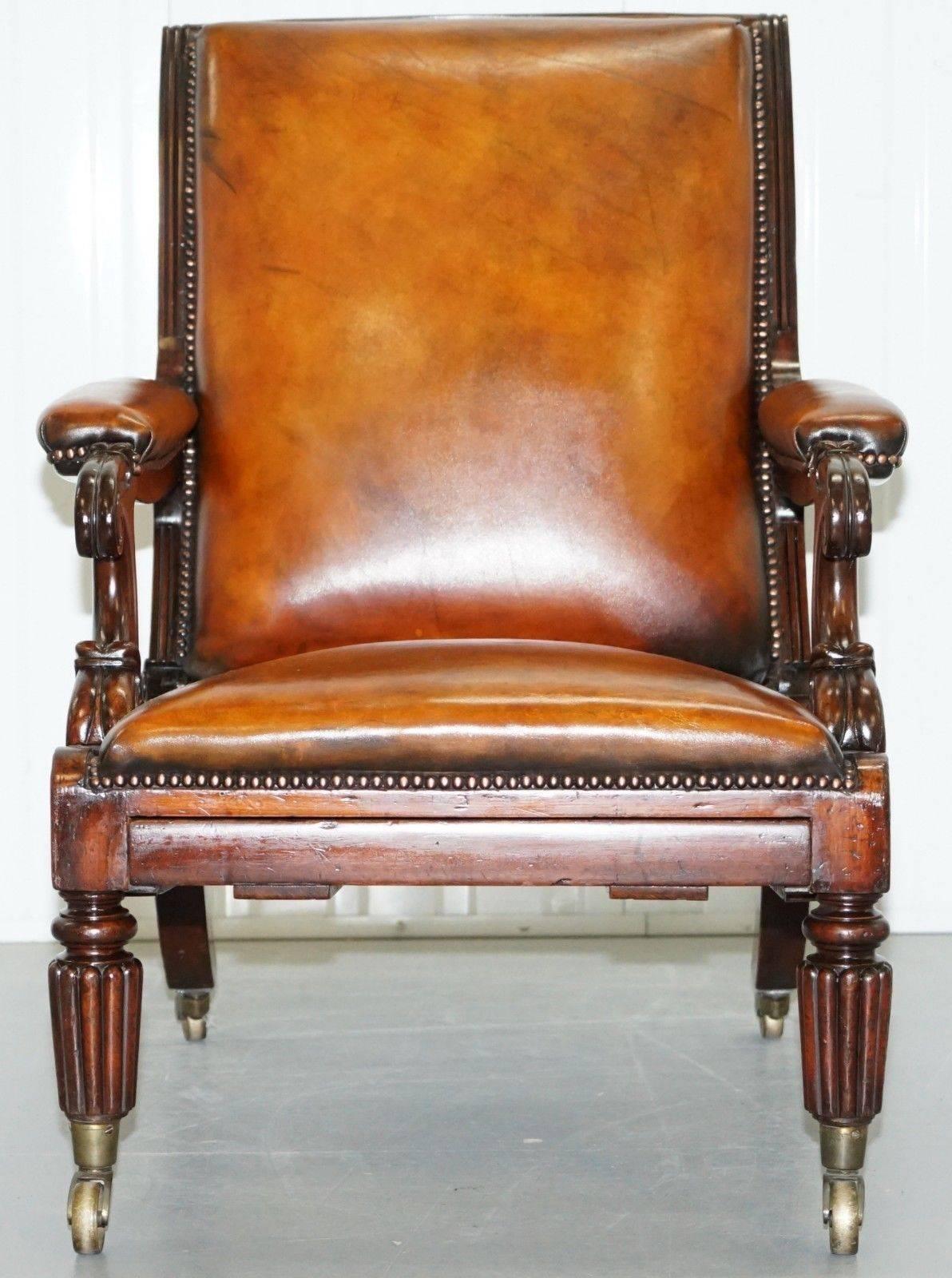 We are delighted to offer for sale this absolutely stunning 100% period correct William IV circa 1835 mahogany reclining library reading armchair with built in footrest

This chair is a wonder to behold, the reclining action is operated by two