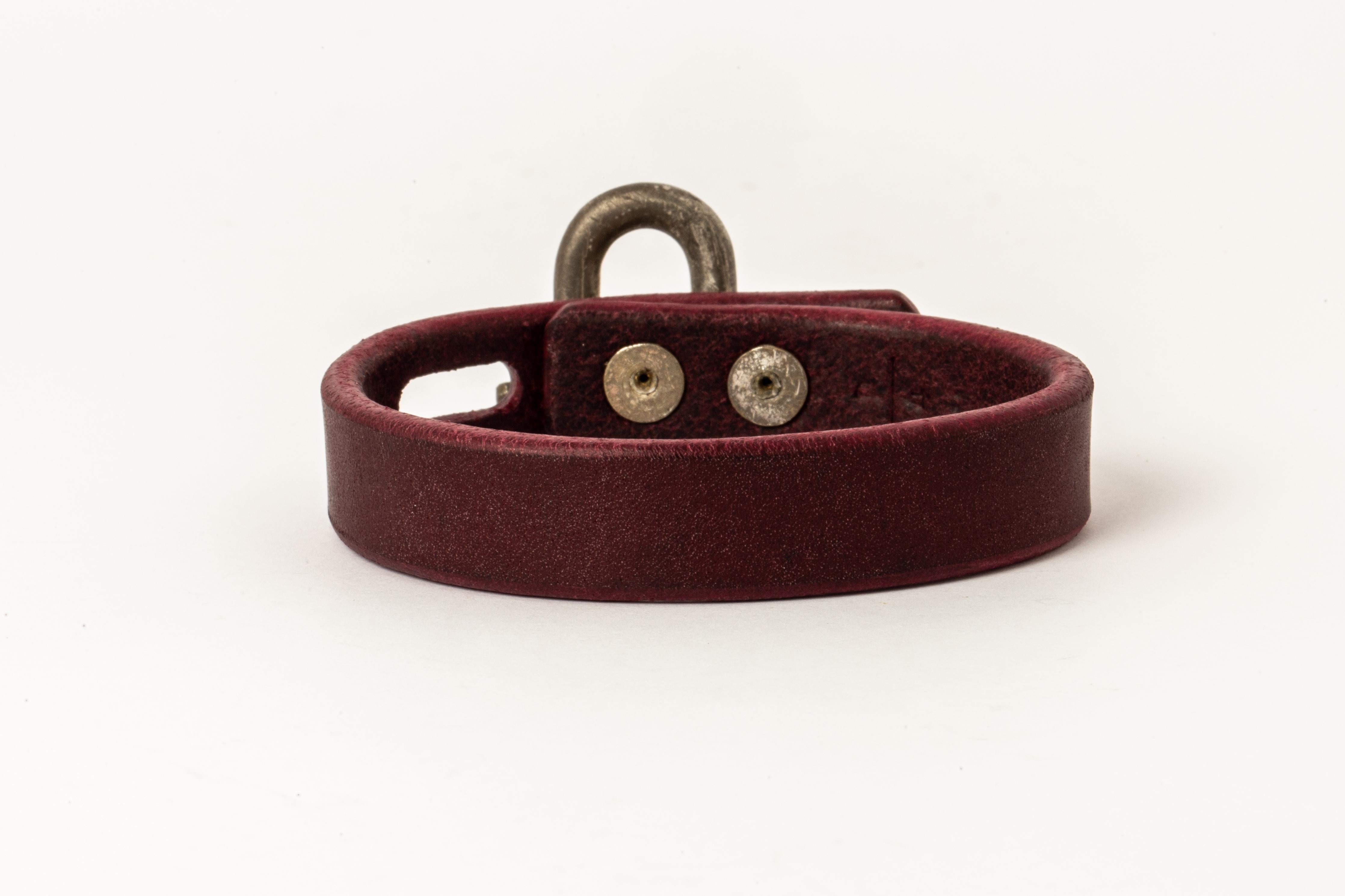 Bracelet in wine buffalo leather and super heavy acid treated gold plated brass. Items with the potential use as restraints. All P4X hardware and accessories are compatible and interchangeable.
The Charm System is an interrelated group of products