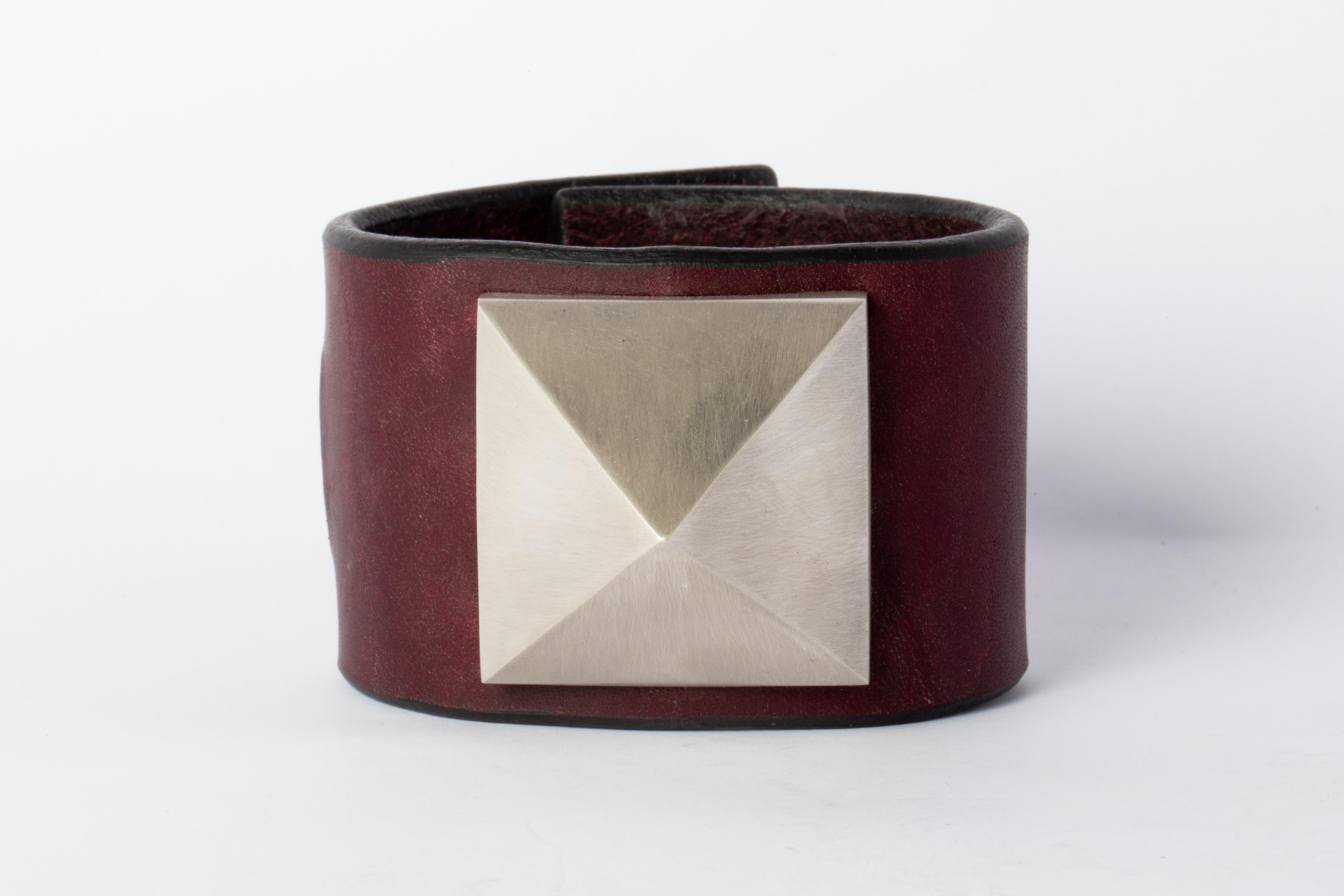 Bracelet in wine buffalo leather and electroplated brass with silver and then dipped into acid to create the subtly destroyed surface. Items with the potential use as restraints. All P4X hardware and accessories are compatible and interchangeable.