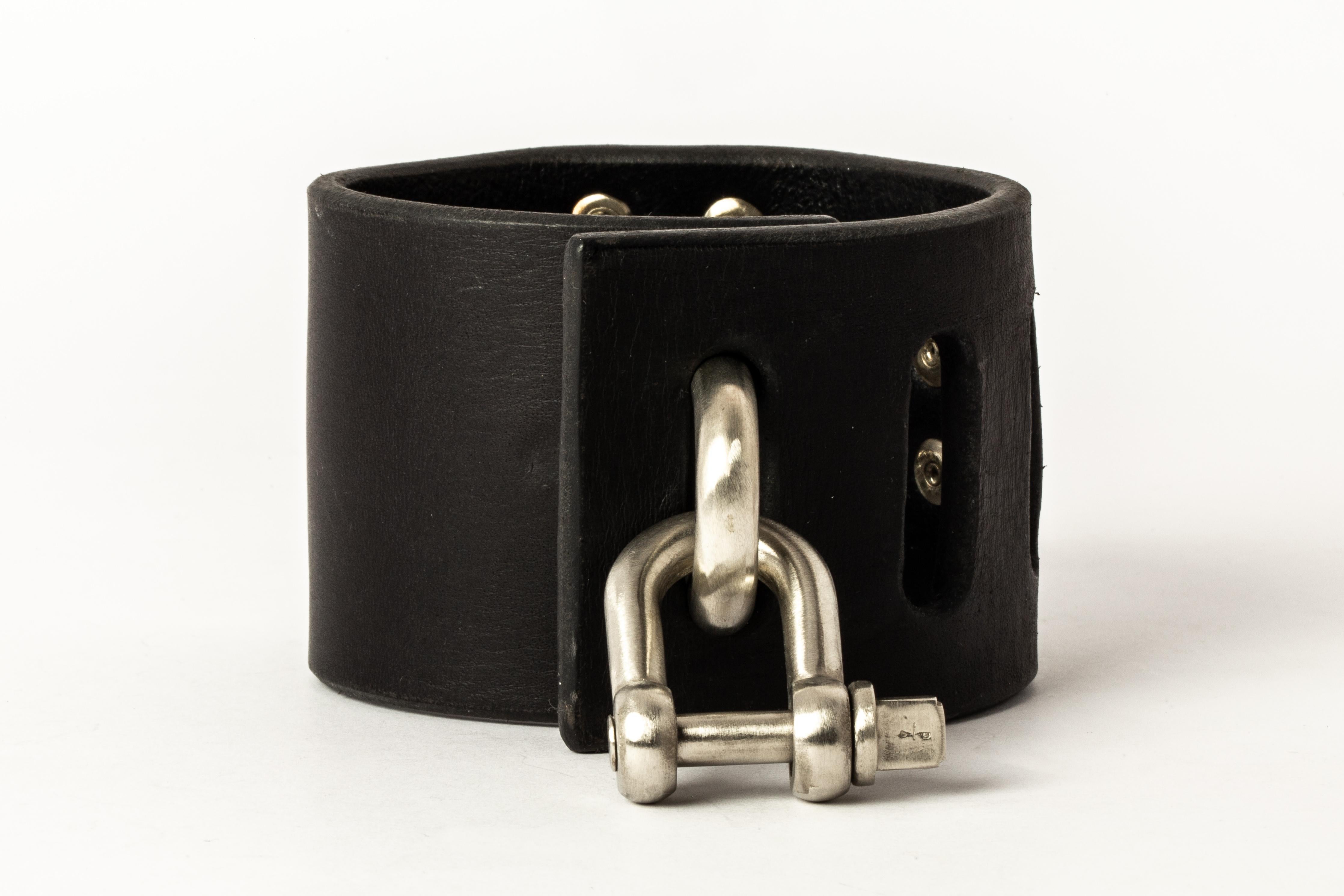 Bracelet in black buffalo leather and white bronze. Items with the potential use as restraints. All P4X hardware and accessories are compatible and interchangeable.
The Charm System is an interrelated group of products that can be mixed and matched
