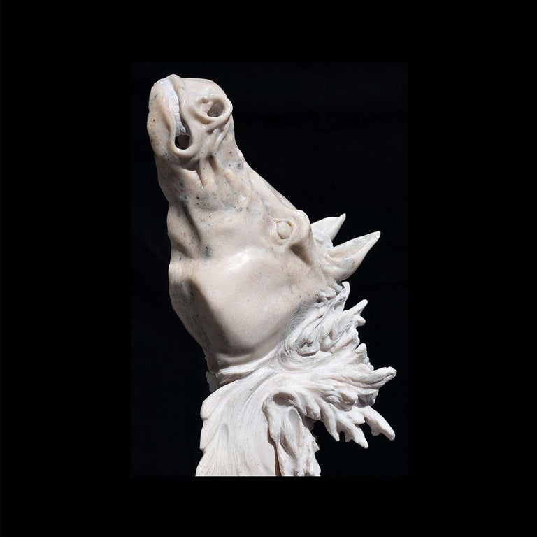 Entirely handmade using ancient techniques, this marble sculpture of a horse is a magnificent piece of art that will boldly shape the character of any room. Drawing from mythological themes, the horse's contorted snout in pink marble and wispy hair