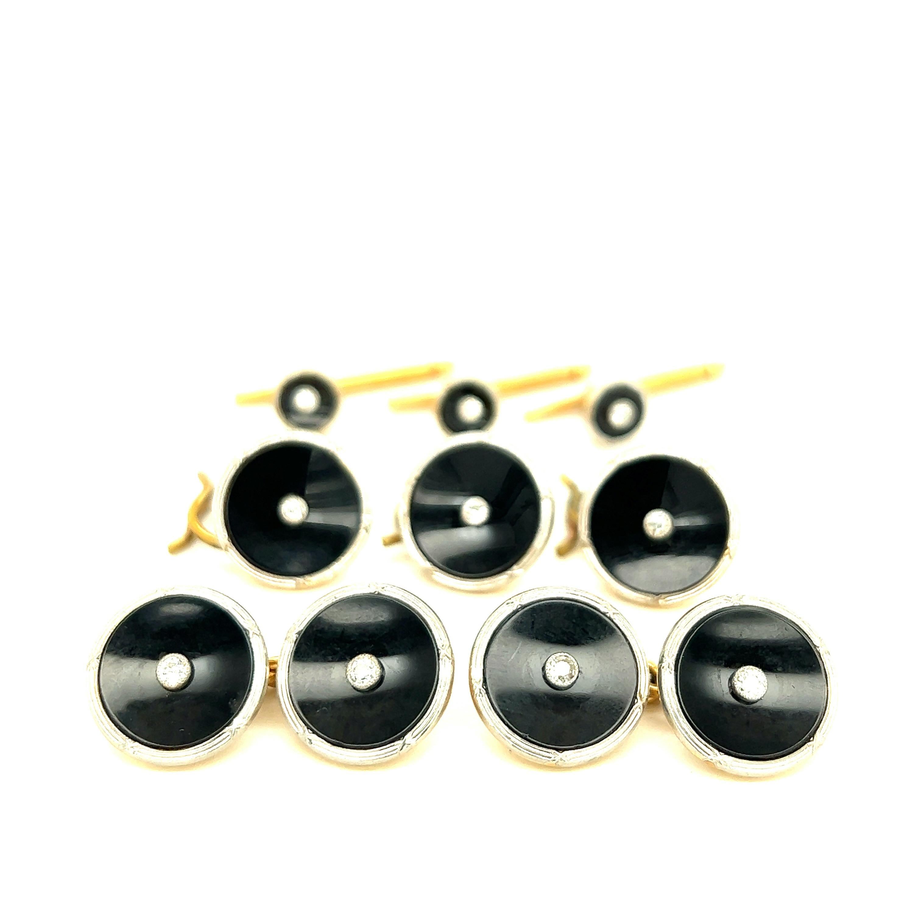 Retailed by Marcus & Co. Black Onyx Diamond Complete Dress Set

Round shape platinum with round shape black onyx discs, featuring round-cut bezel-set diamonds of approximately 0.40 carat and 18 karat yellow gold back

Size: Larger width 14 mm;