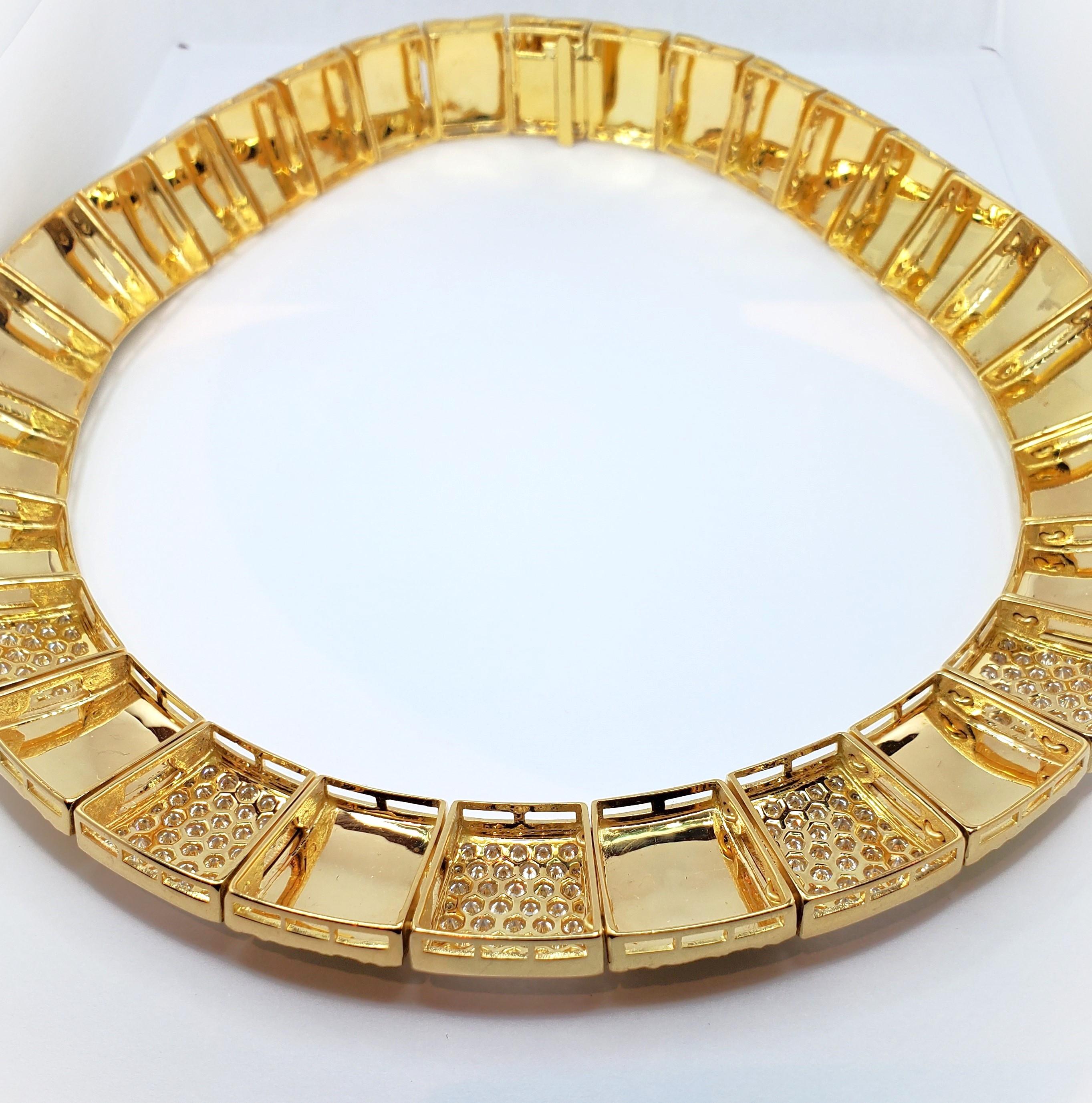 Channel your inner Cleopatra with this awe-inspiring necklace that draws inspiration from high end royal jewelry worn in ancient times. The reticulated gold segments are created out of 18k yellow gold and feature five sections of pave-set shimmering