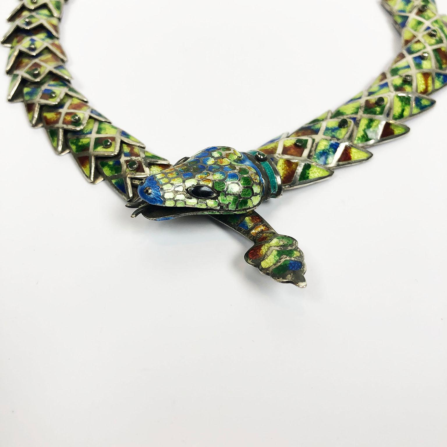 Amazing reticulated snake necklace made of silver in green blue and red enamel with accented raised enamel joints Early mark - Late 1960s. -by Jeronimo Fuentes.

Jeronimo Fuentes was a silversmith who worked for Margot De Taxco and later as
