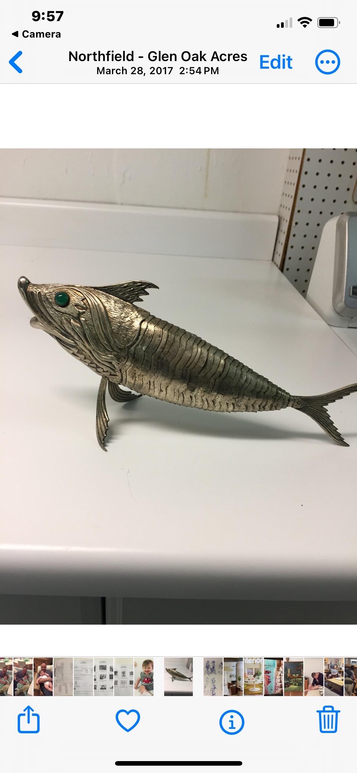 This is a unique reticulated silver plated fish with cabachon eyes and very detailed body 