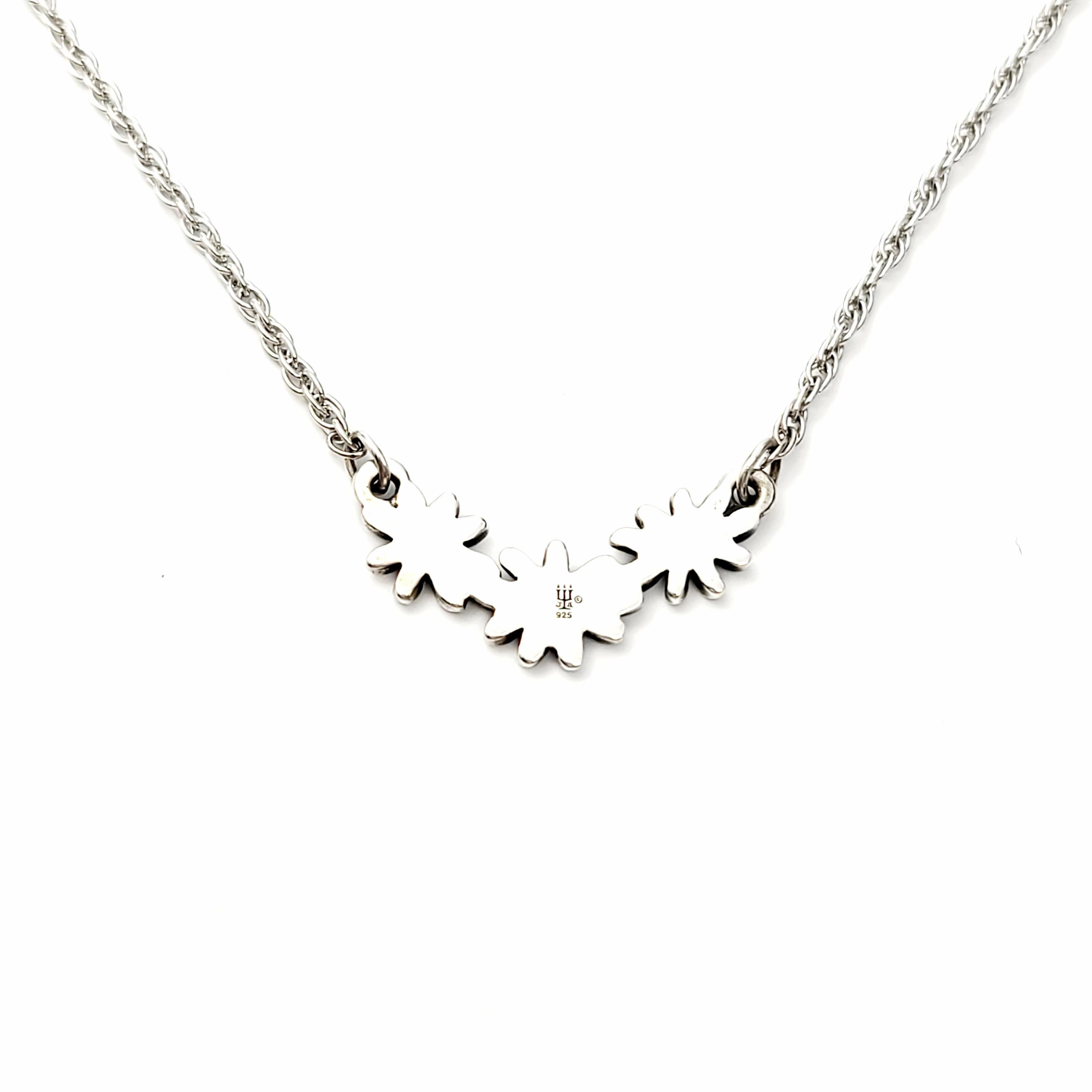 Retired James Avery sterling silver Margarita daisy necklace.

Sweet and delicate necklace featuring three daisies on a chain necklace.

Measures 16