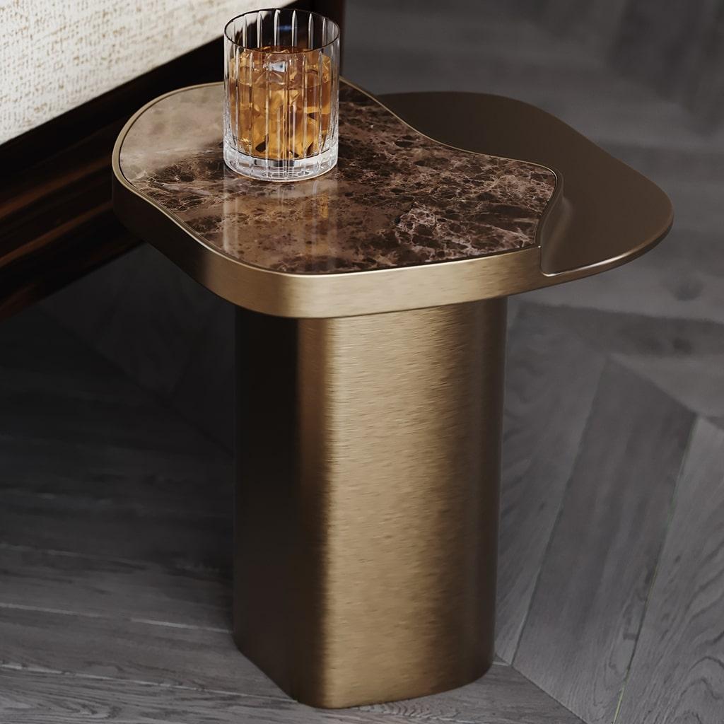 Retiva Side Table is a sculptural fusion of modern design and refined materials, crafted to bring elegance and functionality to any space. With its organic tabletop in luxurious natural stone and a sleek brushed metal base, the Retiva Side Table is