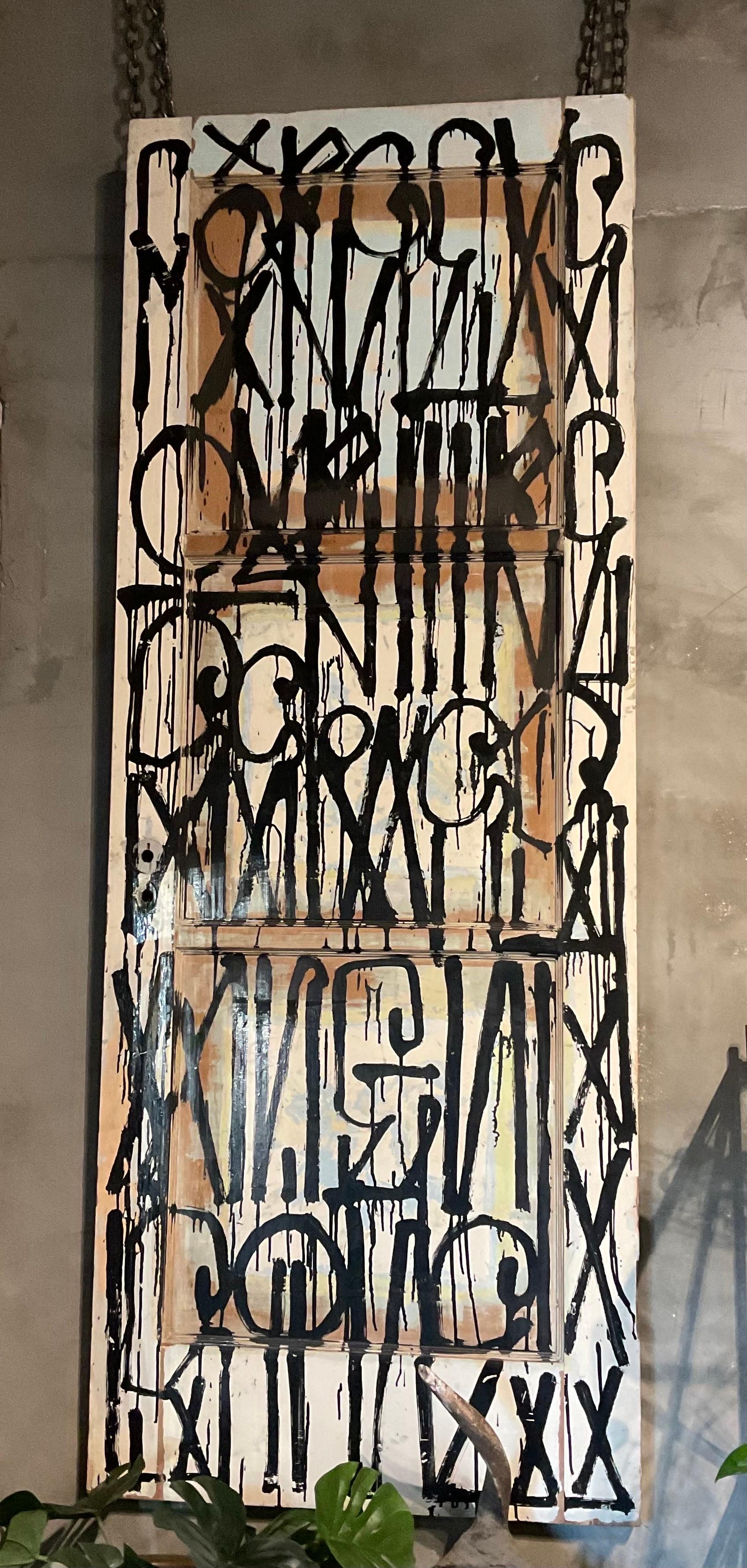 Early Work by the Artist Retna
Graffiti 
Pair of Wood Doors Painted by Retna with his Signature Font & Alphabet
We currently have these doors hung on the wall with Chains
The chains can be removed and the doors could lean against a wall, or be