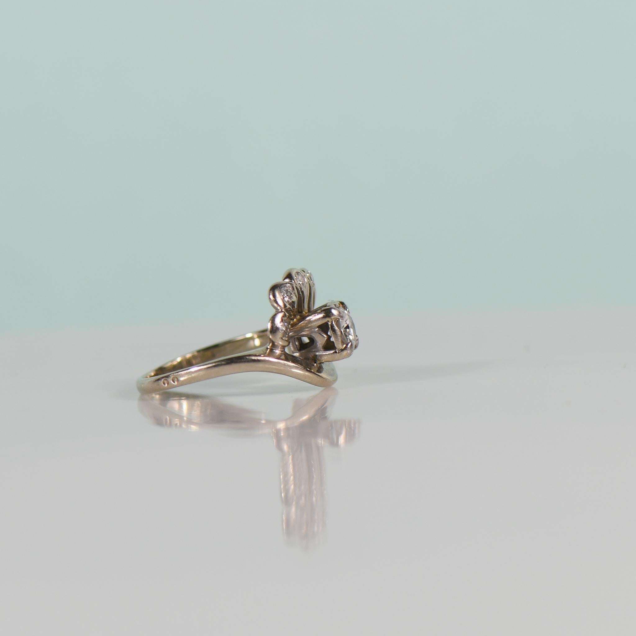 Step back in time with this enchanting Retro cocktail ring featuring a dazzling 0.39 carat Old European Cut diamond, a nod to the glamour of a bygone era. Set in luminous 14k white gold, the diamond takes center stage, exuding a captivating sparkle