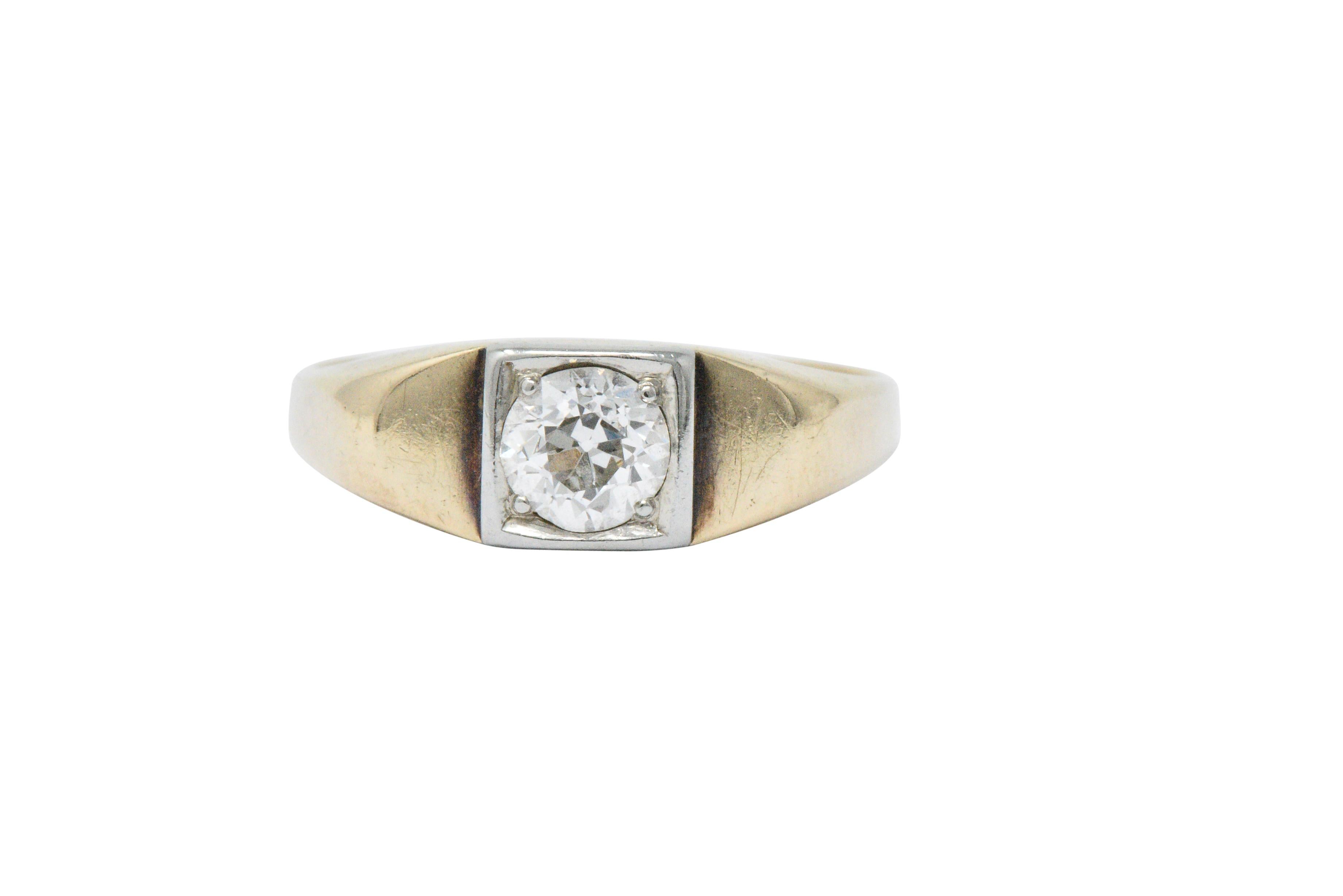 Centering an old European cut diamond weighing approximately 0.45 carats, I color and VS clarity

In a square form platinum head with wide polished gold shoulders

A very modern look with a low profile , perfect for the hands on ring wearer

Ring