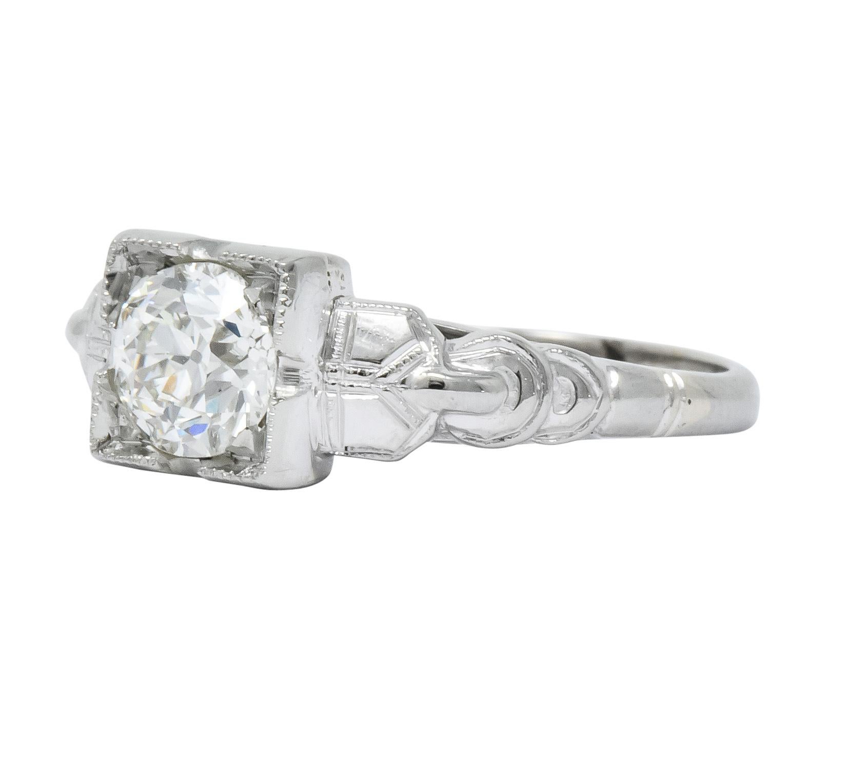 Centering an old European cut diamond weighing 0.64 carat total, J color and SI1 clarity

Square form head with engraved gold details

Unusual solitaire style ring

Stamped 14K

Ring Size: 5 & Sizable

Top measures 6.5 mm and sits 5.5 mm high

Total