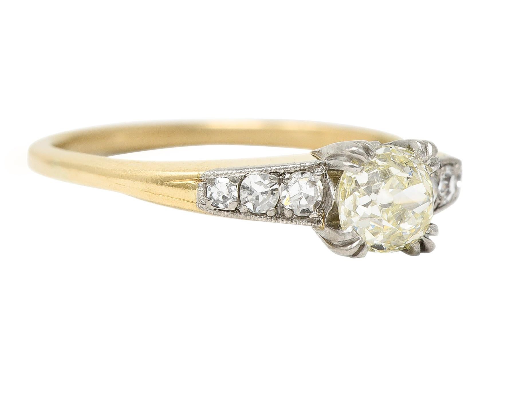 Centering an old European cut diamond weighing approximately 0.58 carats - Light Yellow with VS2 clarity
Set with tri-split prongs in a platinum square form head with 'W' shaped profile 
Flanked by single cut diamonds bead set in platinum shoulders 