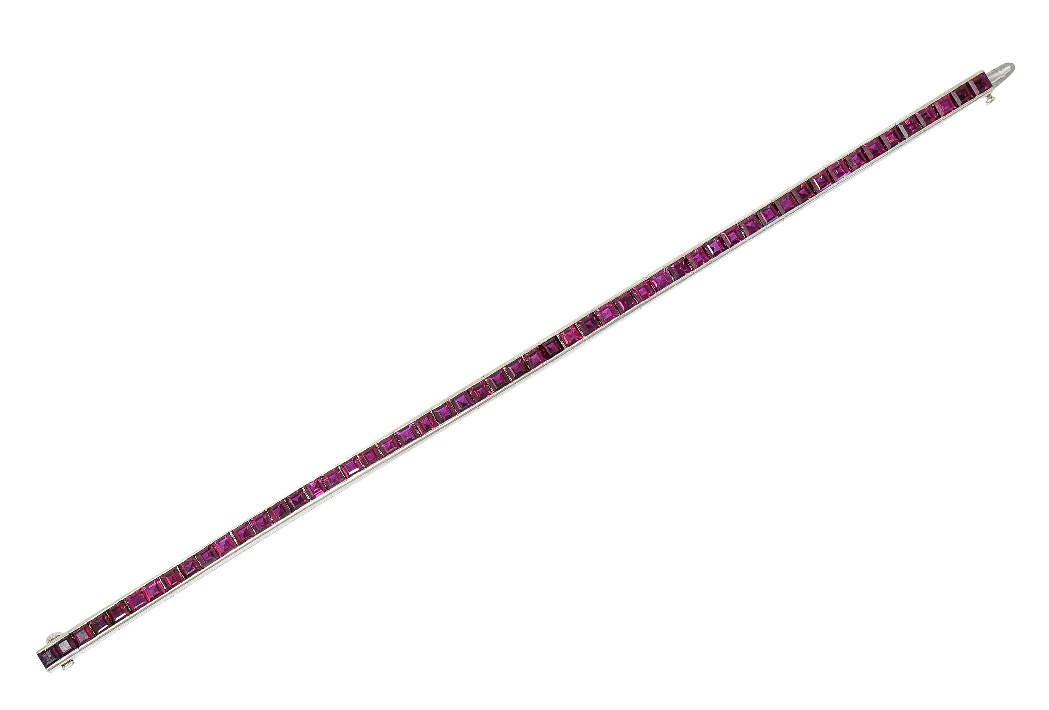 Line bracelet is comprised of channel set square links

Featuring well matched purplish red rubies weighing in total approximately 13.25 carats

Completed by a concealed clasp with fold over safety

Tested as platinum

Circa: 1940s

Length: 7 1/8