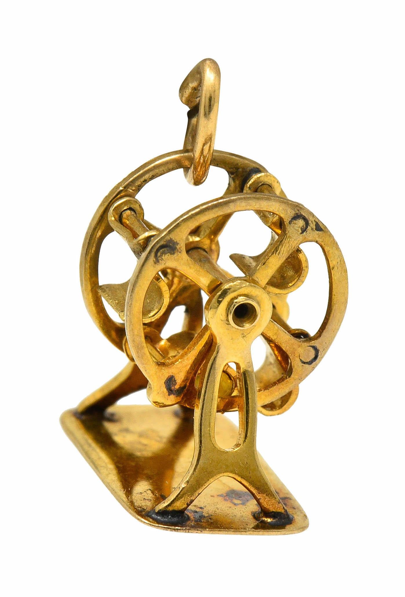 Designed as a circular rotating Ferris wheel within a polished gold frame

Fancifully pierced with articulated seats that dangle as wheel spins

Stamped 14K for 14 karat gold

Circa: 1950s

Measures: 1/2 x 1/2 inch

Total weight: 1.4 grams

Fun.