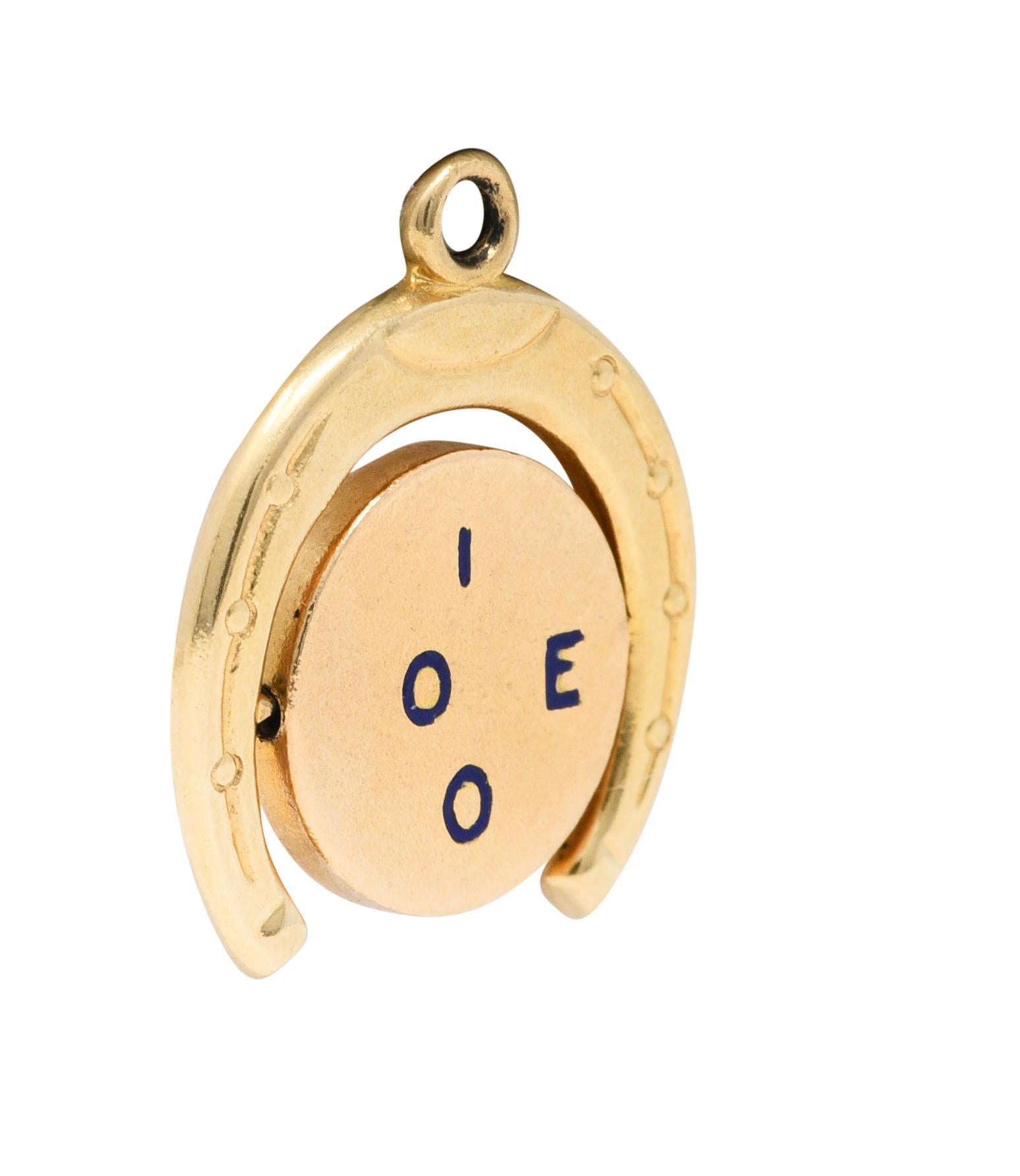 Charm is designed as a stylized horseshoe

With a rotating circular center

Emblazoned by royal blue enamel letters

That spell 'I Love You' when spun - thaumatrope illusion

Stamped 14K for 14 karat gold

Circa: 1940s

Measures: 5/8 x 3/4 inch