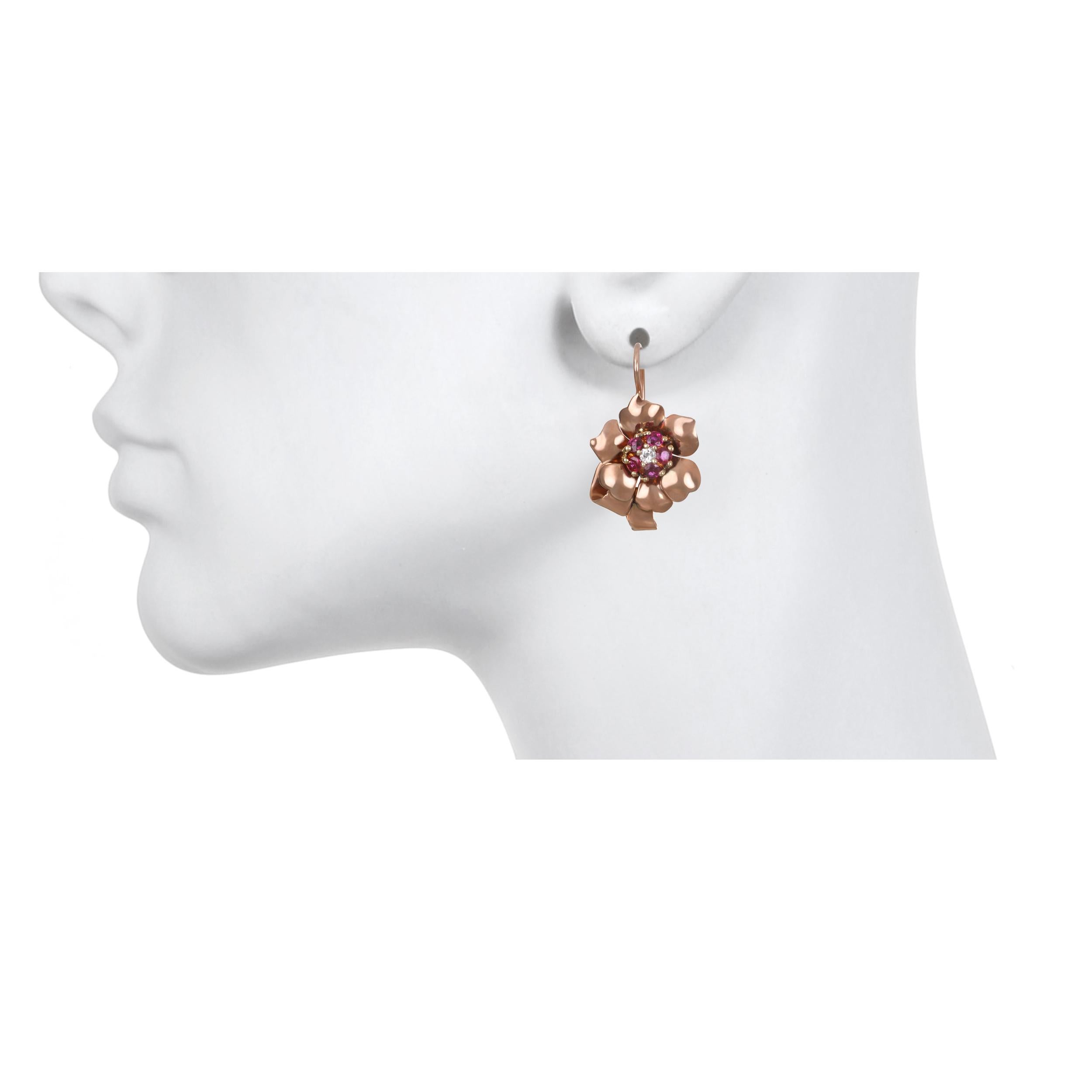14 Karat Rose Gold Diamond Ruby Flower Earrings - reworked from a 1940's brooch, these ruby, and diamond floral motif earrings are stylish and wearable.

Rubies = 1.00 carats twt, estimated
Diamonds = .10 carats twt, estimated
L x W .95