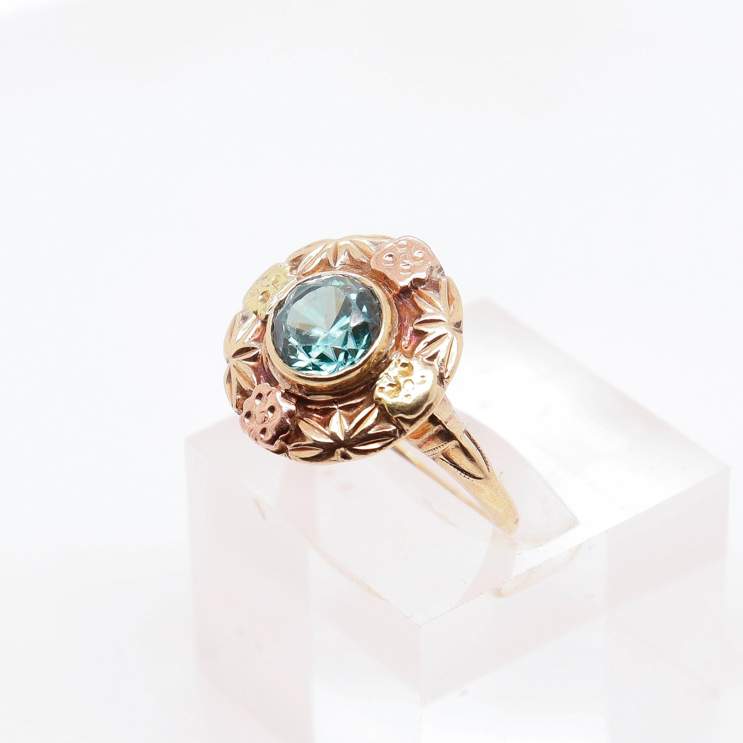 A very fine vintage gold and blue topaz ring.

In 14k yellow and rose golds.

With a large bezel blue topaz gemstone to the center.

Simply a terrific Retro ring!

Date:
20th Century

Overall Condition:
It is in overall fair, as-pictured, used