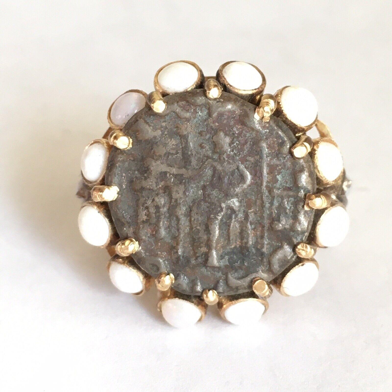 14 Karat Yellow Gold Ancient Coin Ring 
American Hallmarked 1940s
14 Karat yellow gold one 15 mm Coin ring halo,12 pieces of 2.5mm Opals, hallmarked and marked 