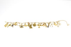 Retro 14 Karat Yellow Gold Charm Bracelet with Moving Charms