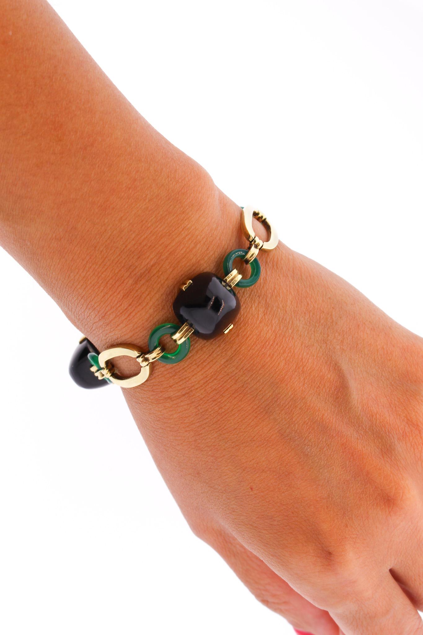 A bold 14k gold Retro era bracelet set with alternating oval gold links, round chrysoprase and sugarloaf onyx sections. The bracelet also features a handsome pattern of alternating oval flat sections and round links. Sometimes these bracelets are