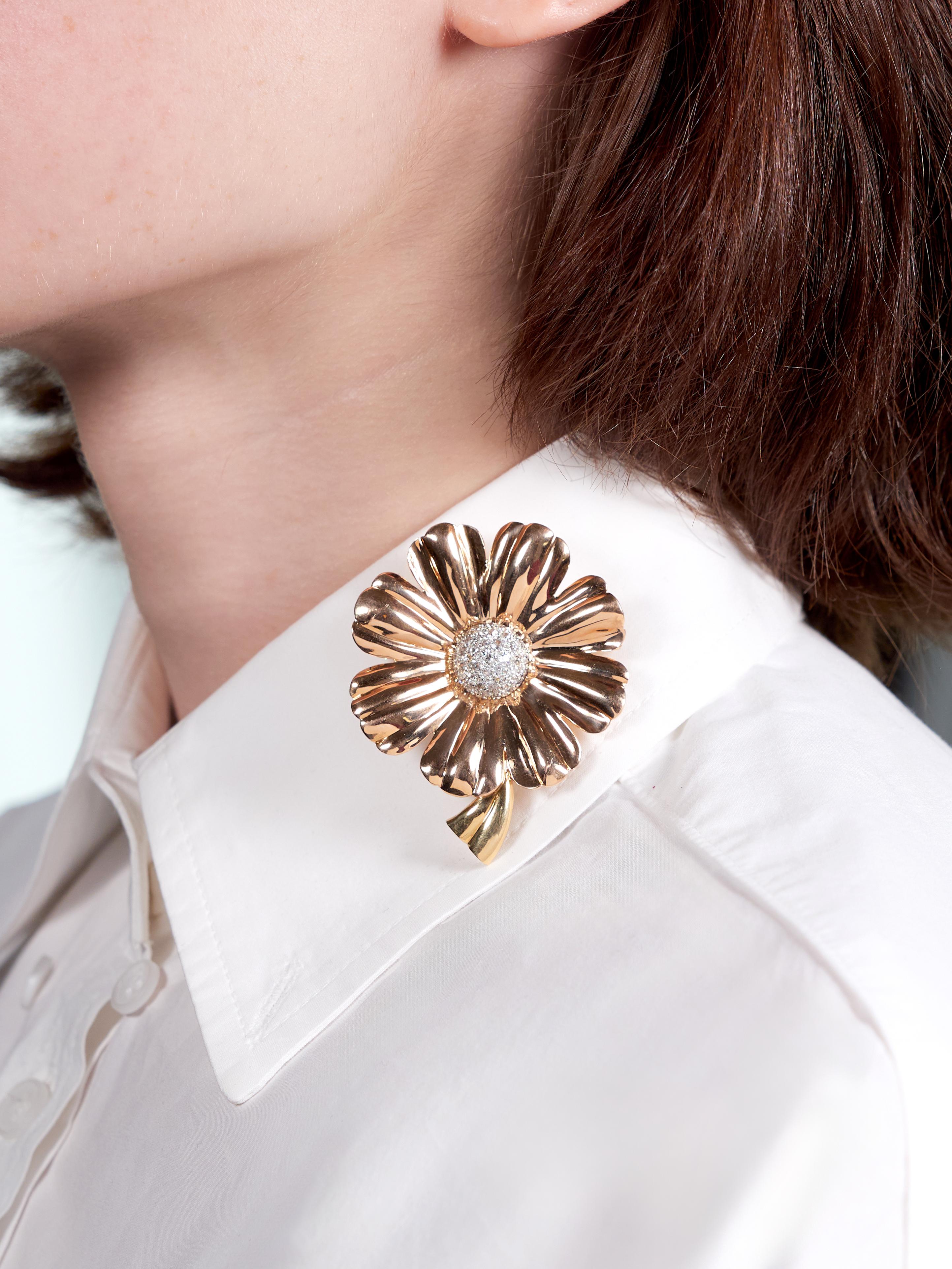 Designed as a dimensional daisy flower with fluted rose gold petals
With a grooved yellow gold stem and a domed white gold center
Pave set with old European cut diamonds throughout
Weighing approximately 1.46 carats total
G/H color with VS2