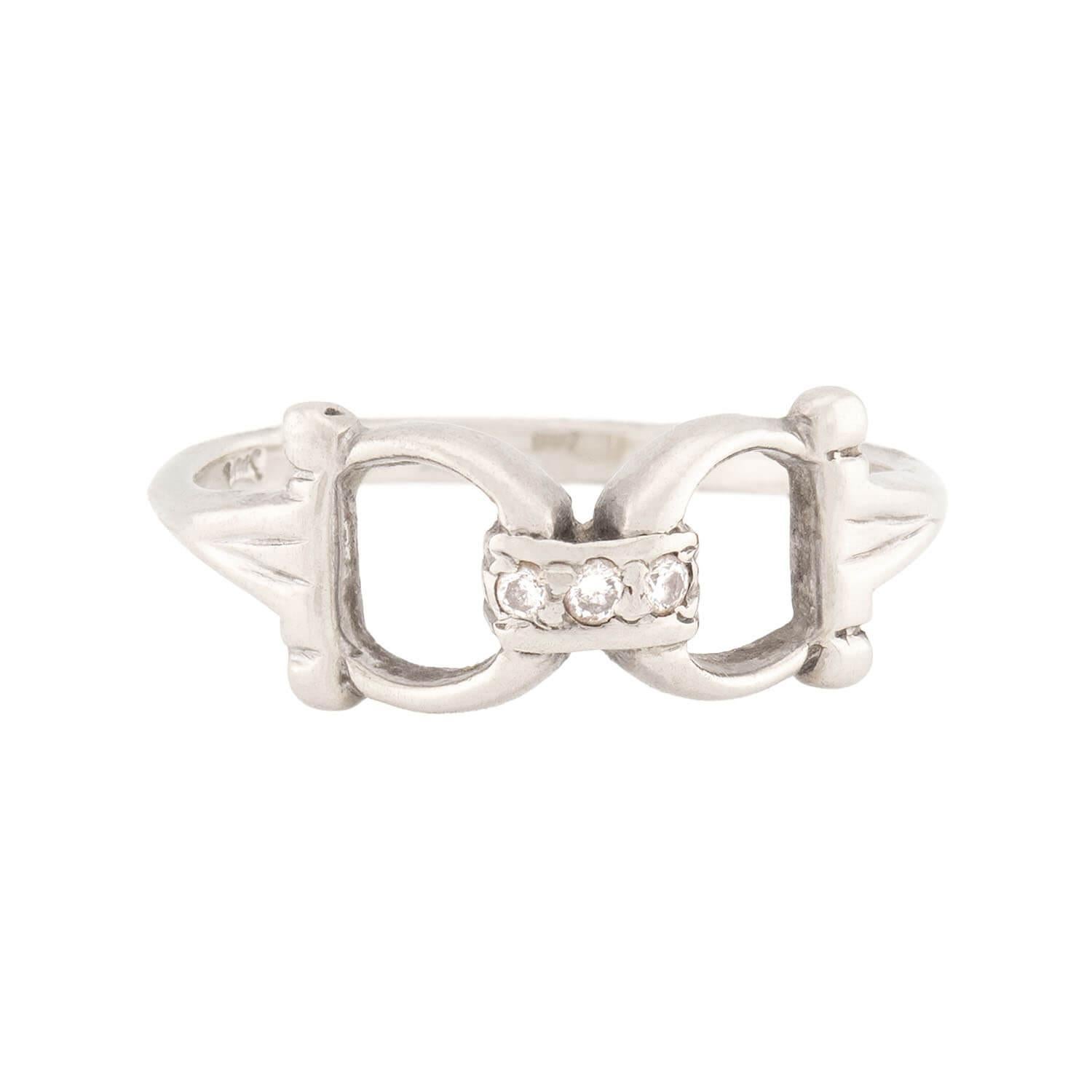 A fabulous equestrian-style ring from the Retro (ca1940s) era! Crafted in 14k white gold, this the center of this ring features two 