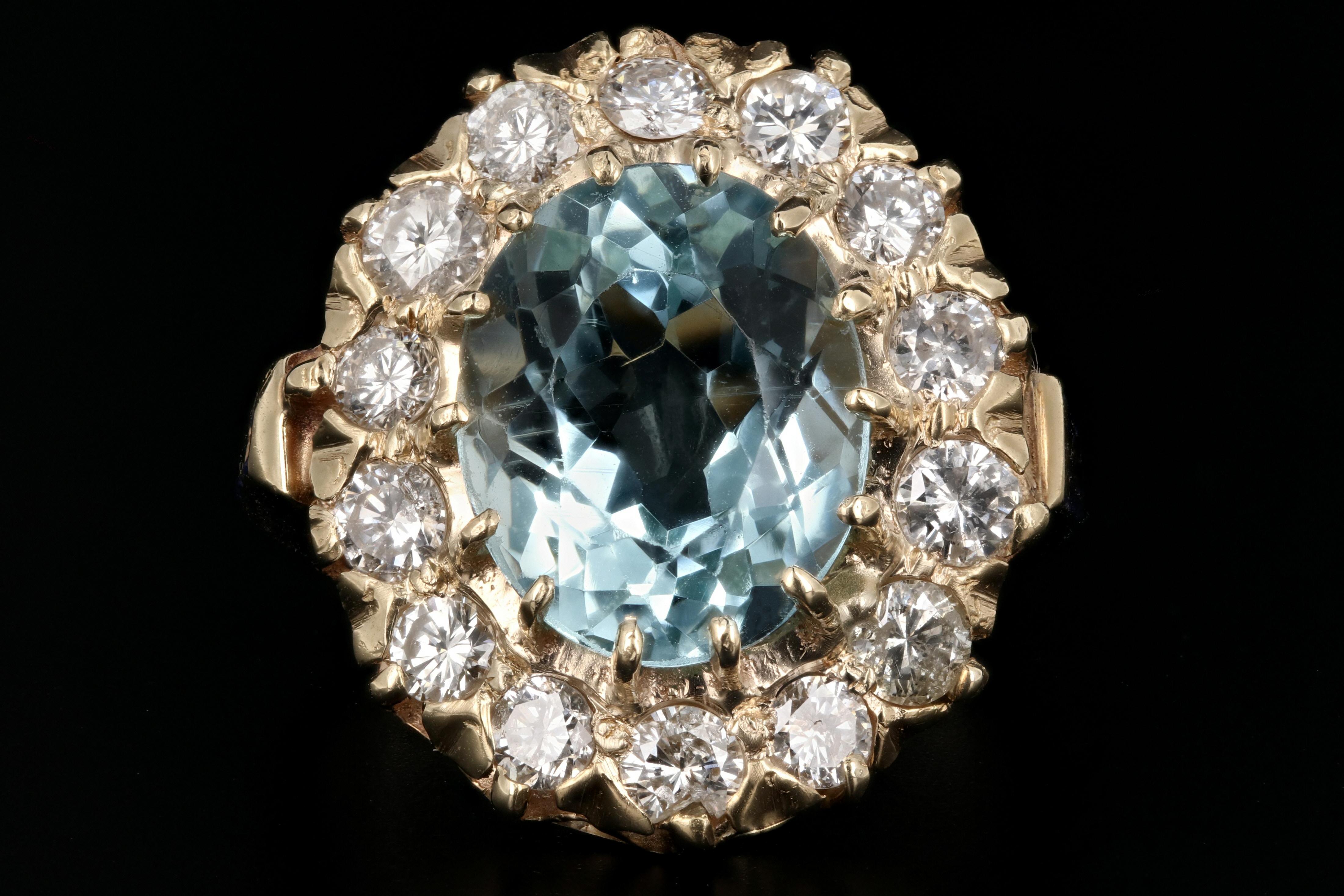 Era: Retro c.1950's

Hallmarks: 14K A

Composition: 14K Yellow Gold

Primary Stone: Oval Cut Aquamarine

Stone Carat: Approximately 4 carats

Accent Stone: Diamonds

Color/Clarity: G/H - I1

Total Diamond Weight: About 1.3 CTW

Ring Length:
