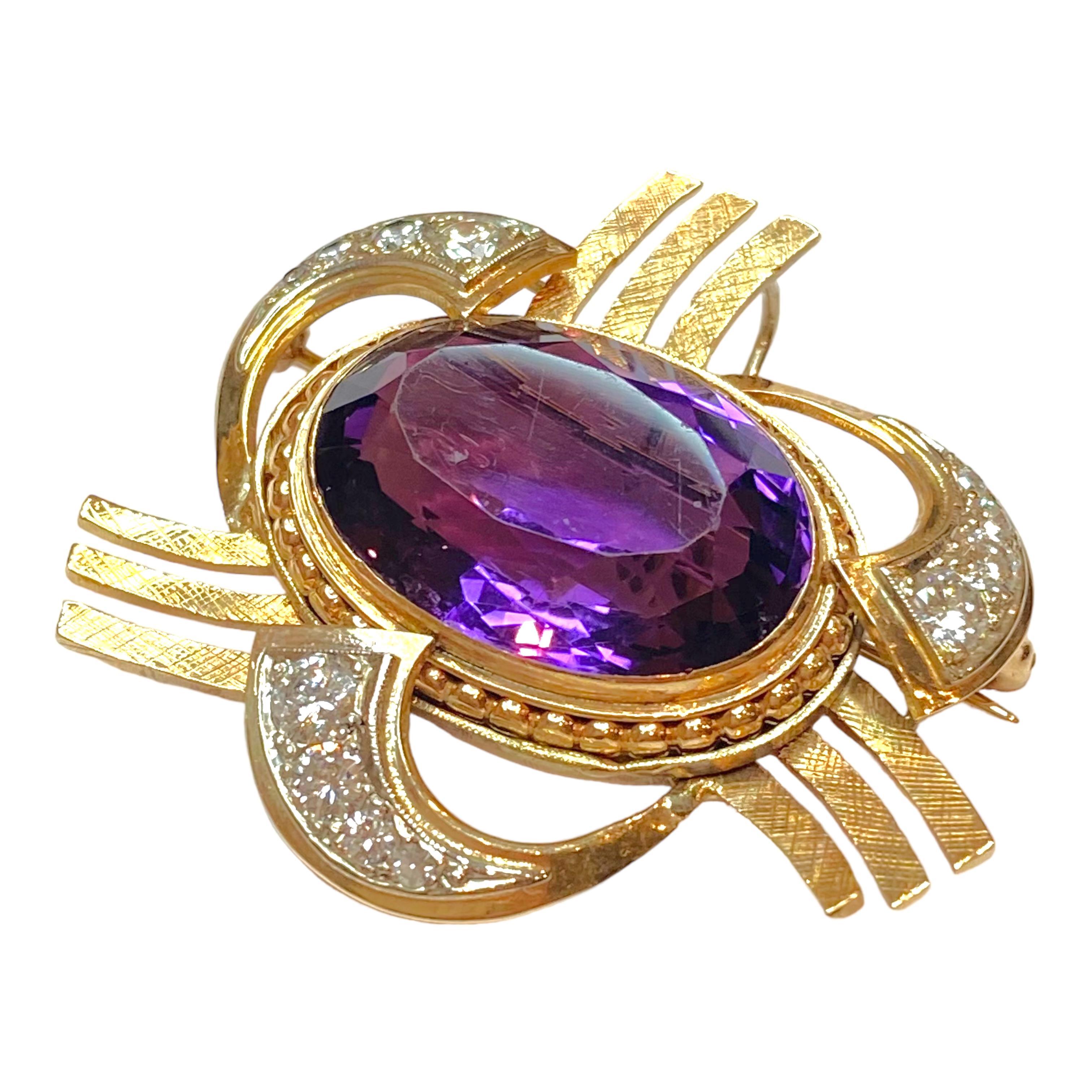 Retro 14K yellow, white and rose gold pendant brooch, featuring a large oval amethyst set in a beaded bezel, surrounded by diamond set ribbons and satin finished gold bars.
Amethyst: 16.0ct.
12 Diamonds: 1.25ctw. Color: G-H, Clarity: