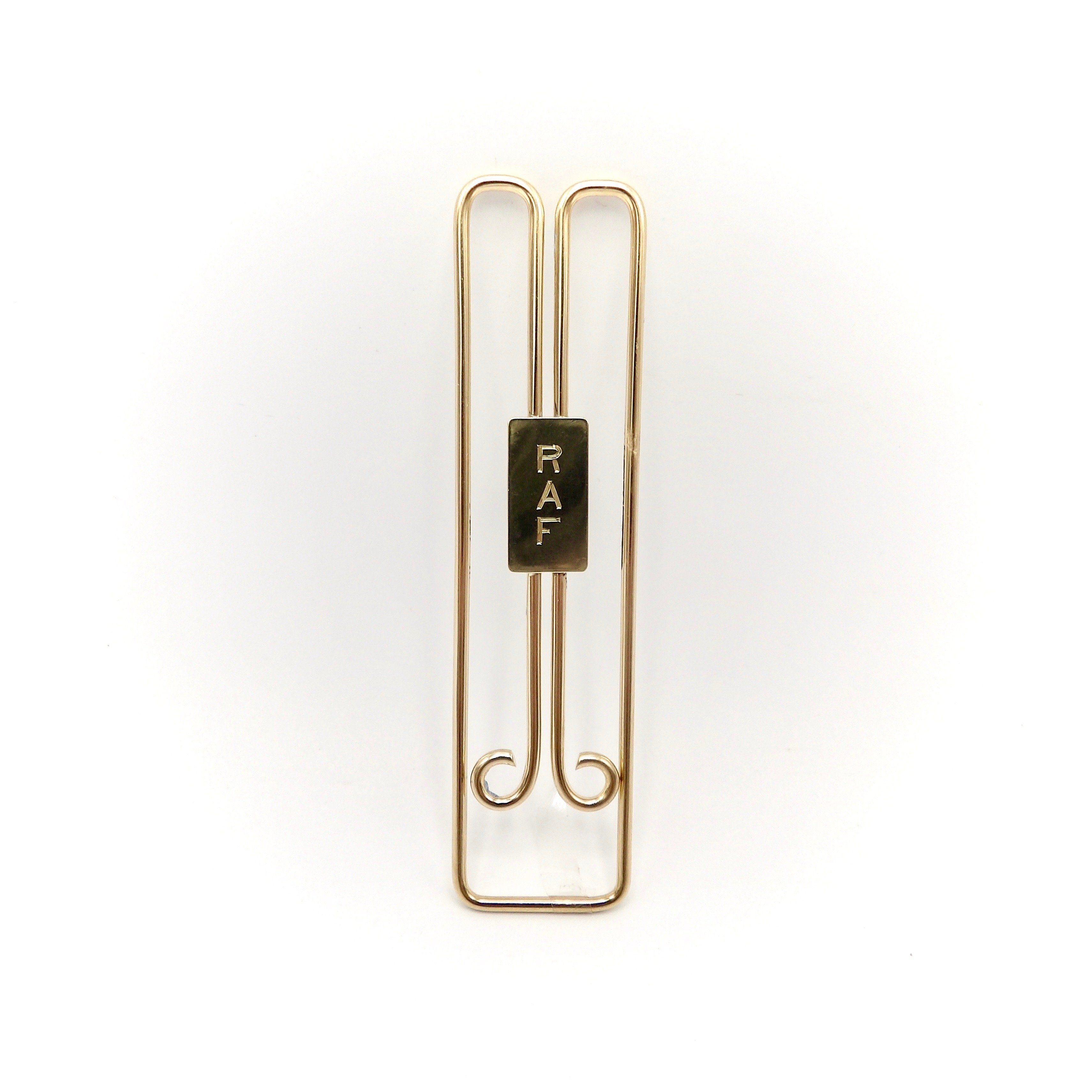 This is an elegantly designed 14 karat gold Cartier money clip.  It has a classic retro streamline design.  Made out of round heavy gold wire that is 1.8mm thick, it has been masterfully bent into this clip shape. The curling in of the end wires is