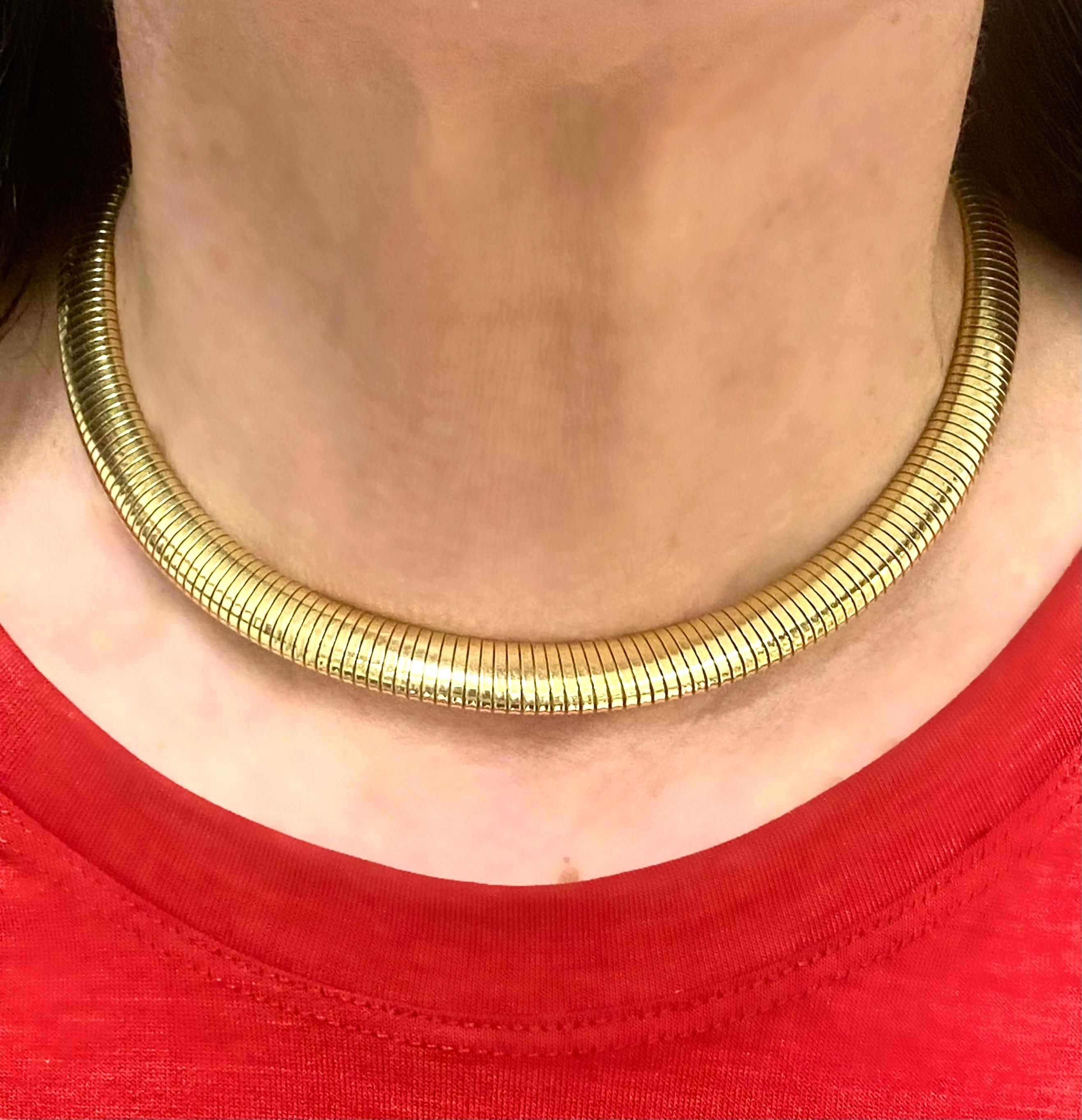 A Retro 14k gold necklace by the Forstner jewelry company, made in a sleek tubogas design. Due to a well-balanced thickness, the necklace creates a slim, elegant line on a neck. It’s an amazing everyday piece that can be dressed-up by adding a