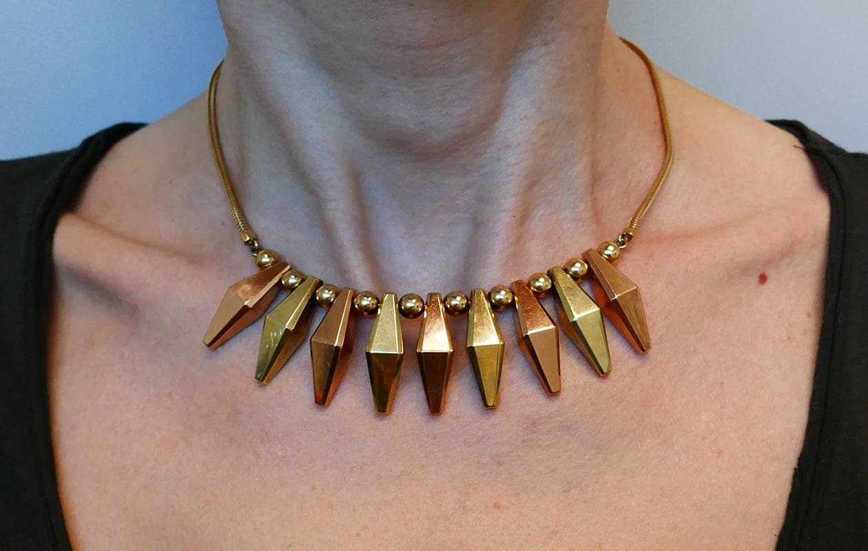 Feminine Retro necklace made of 14 karat (stamped) yellow and rose gold. 
Measurements: Length 16