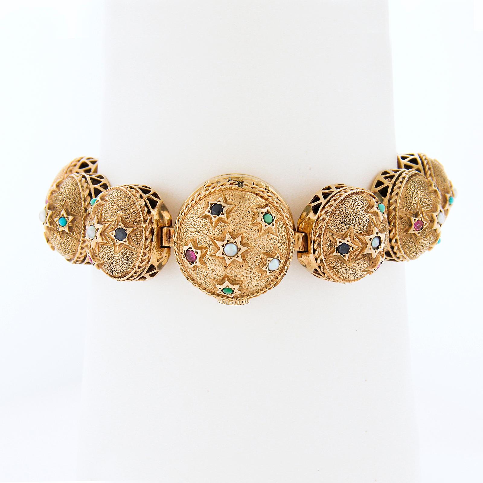 This very unique looking vintage wrist watch/bracelet features an 18mm, solid 14k gold round sphere shaped case and links that are adorned with unique textured finish and decorated with numerous stars that are gemmed with natural seed pearls,