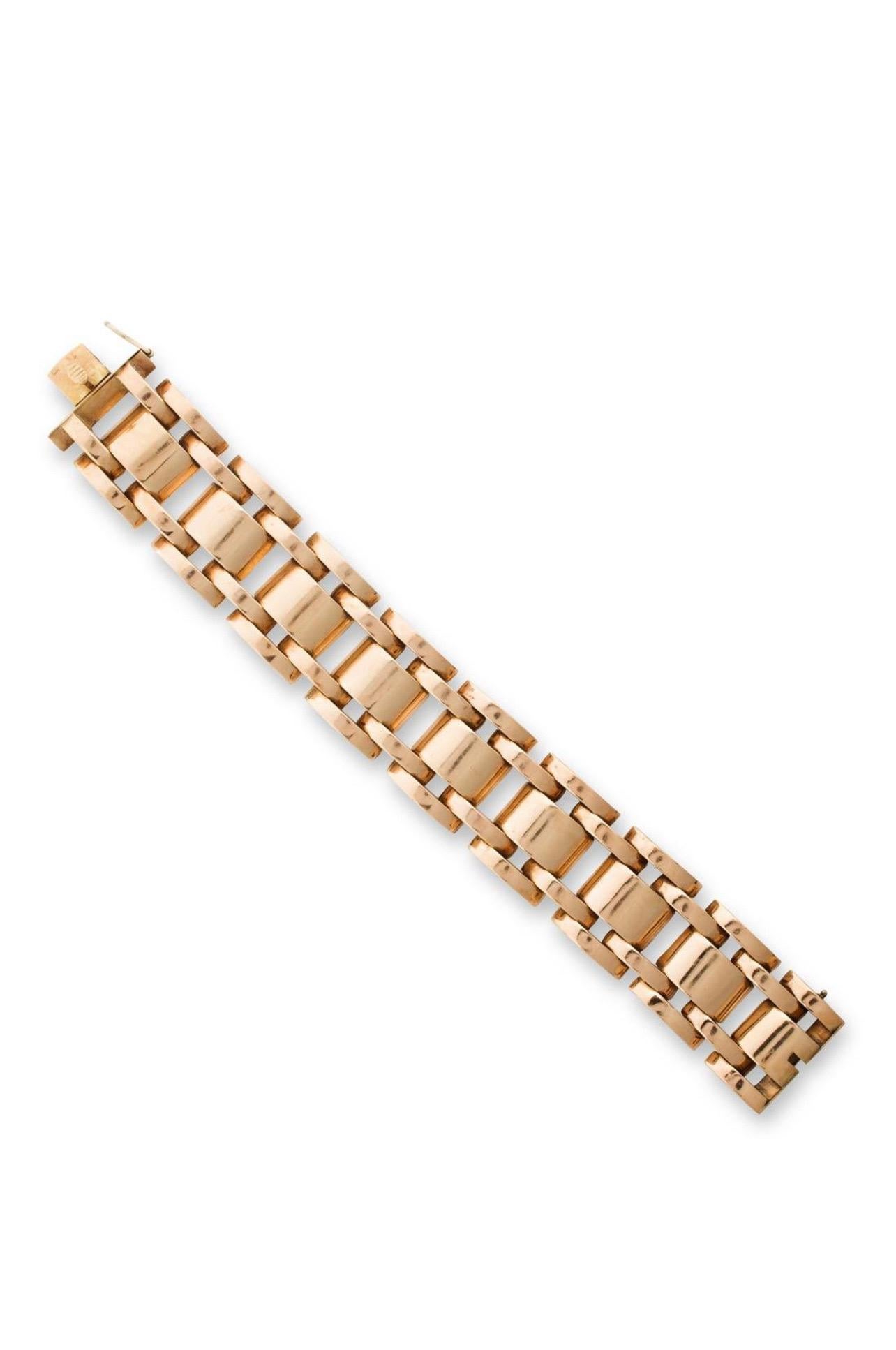 A Retro period 1940’s 14K rose gold tank bracelet. Length is 8”, Width 1”, and 3/8” in height. Substantial weight of 103.5 grams.