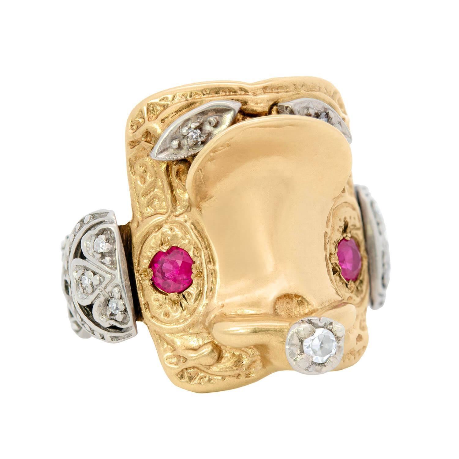 A fabulous mixed metals ruby and diamond saddle ring from the Retro (ca1940) era! This beautiful ring is made of 14k gold and portrays a fabulous 3D design of a saddle crafted in yellow and white gold with diamond and ruby accents. The highly