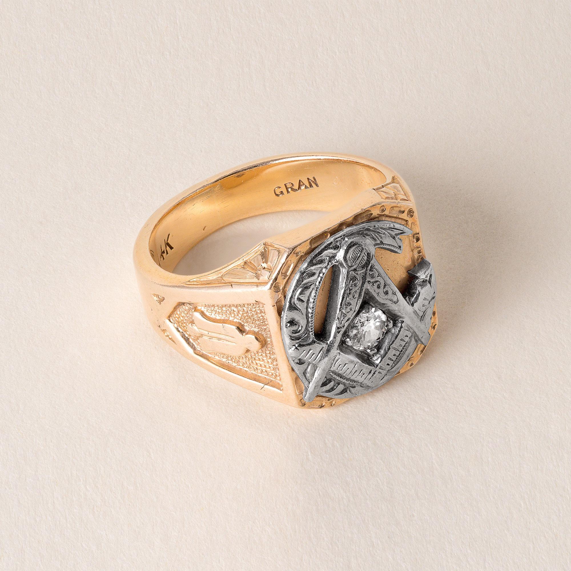 Circa 1950's Masonic ring
0.18 carat old European cut diamond prong set in white metal
F-G VS-SI
Symbols, bell and a dagger on either sides of the band
The bell symbol is uncommon, however bell is used to summon members, mark transitions, or signal