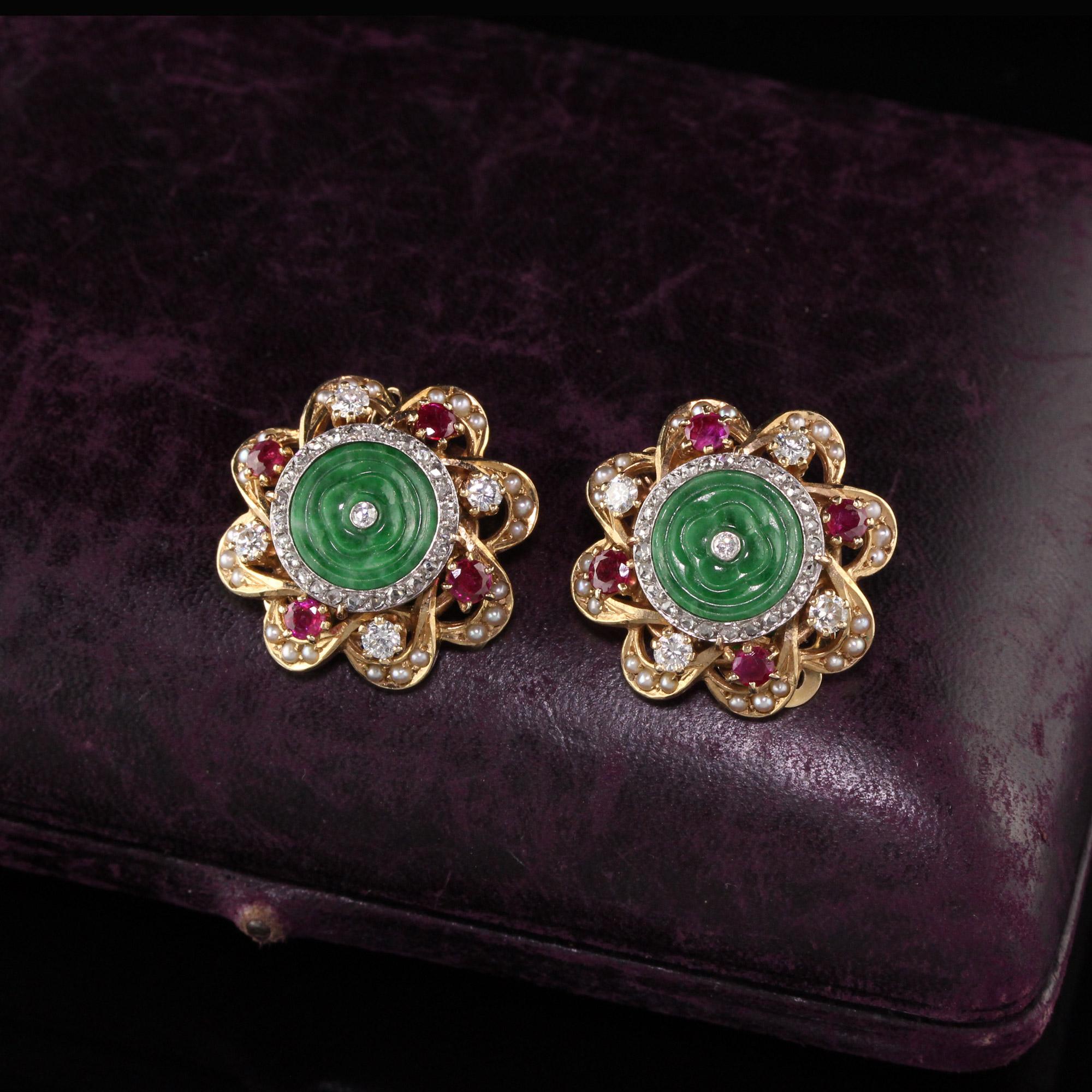 Beautifully designed retro earrings with diamonds, rubies, seed pearls and jades.

#E0013

Metal: 14K Yellow Gold

Weight: 16 Grams

Total Diamond Weight: Approximately 0.75 CTS

Total Ruby Weight: Approximately 0.75 CTS

Measurements: 23.8 mm